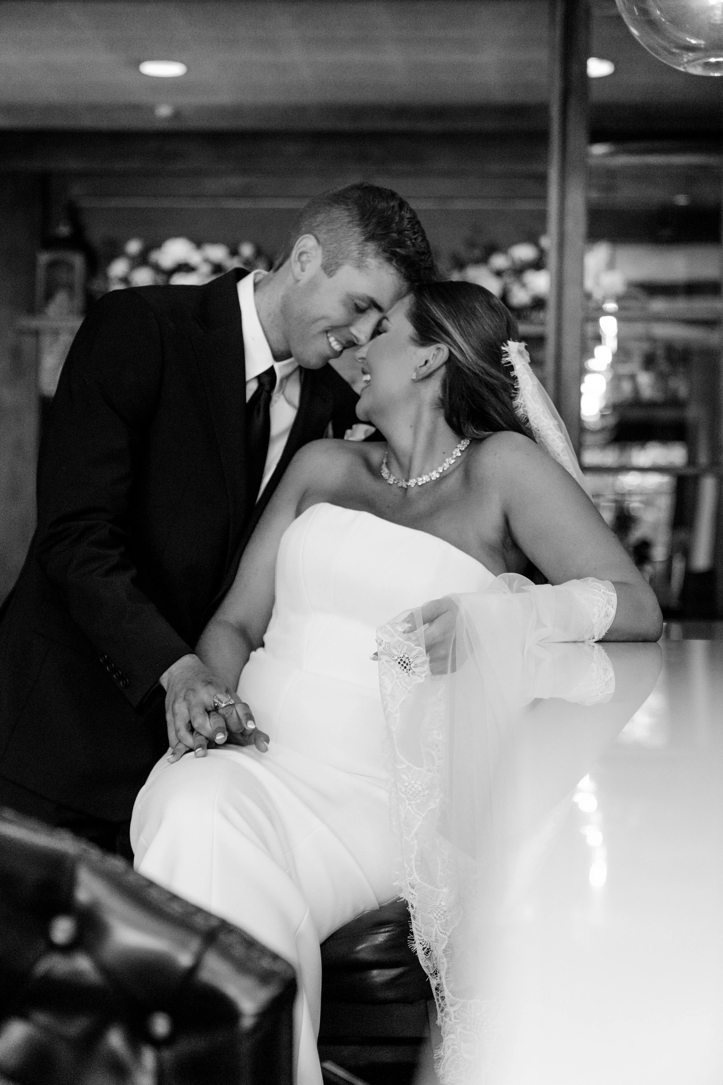 A newlywed couple sharing a quiet moment during their wedding reception. Letty Way Films captures emotional, documentary-style wedding films that preserve genuine connection, heartfelt moments, and timeless memories for New Jersey couples.