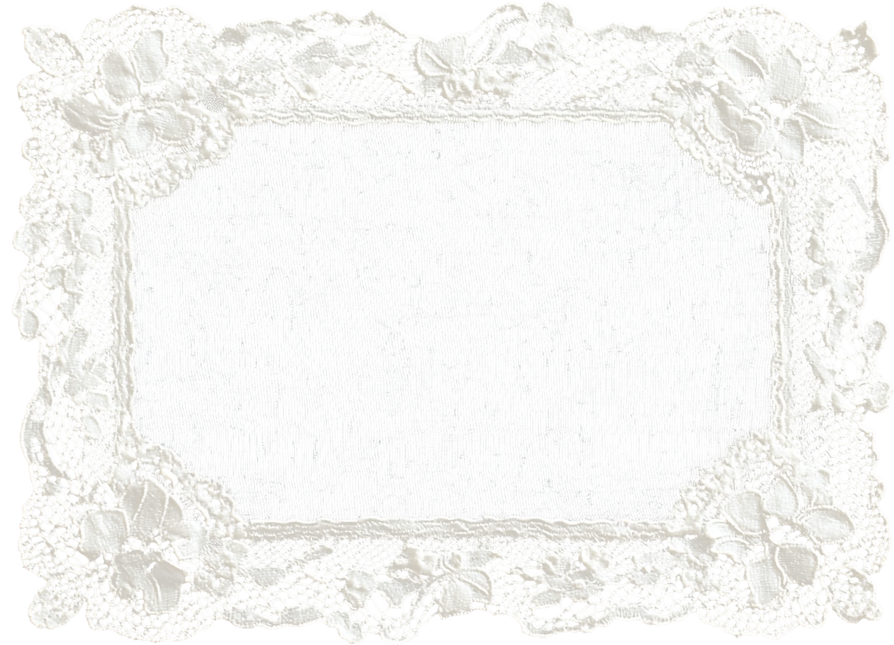 A decorative rectangular lace doily with floral and ribbon patterns inside.
