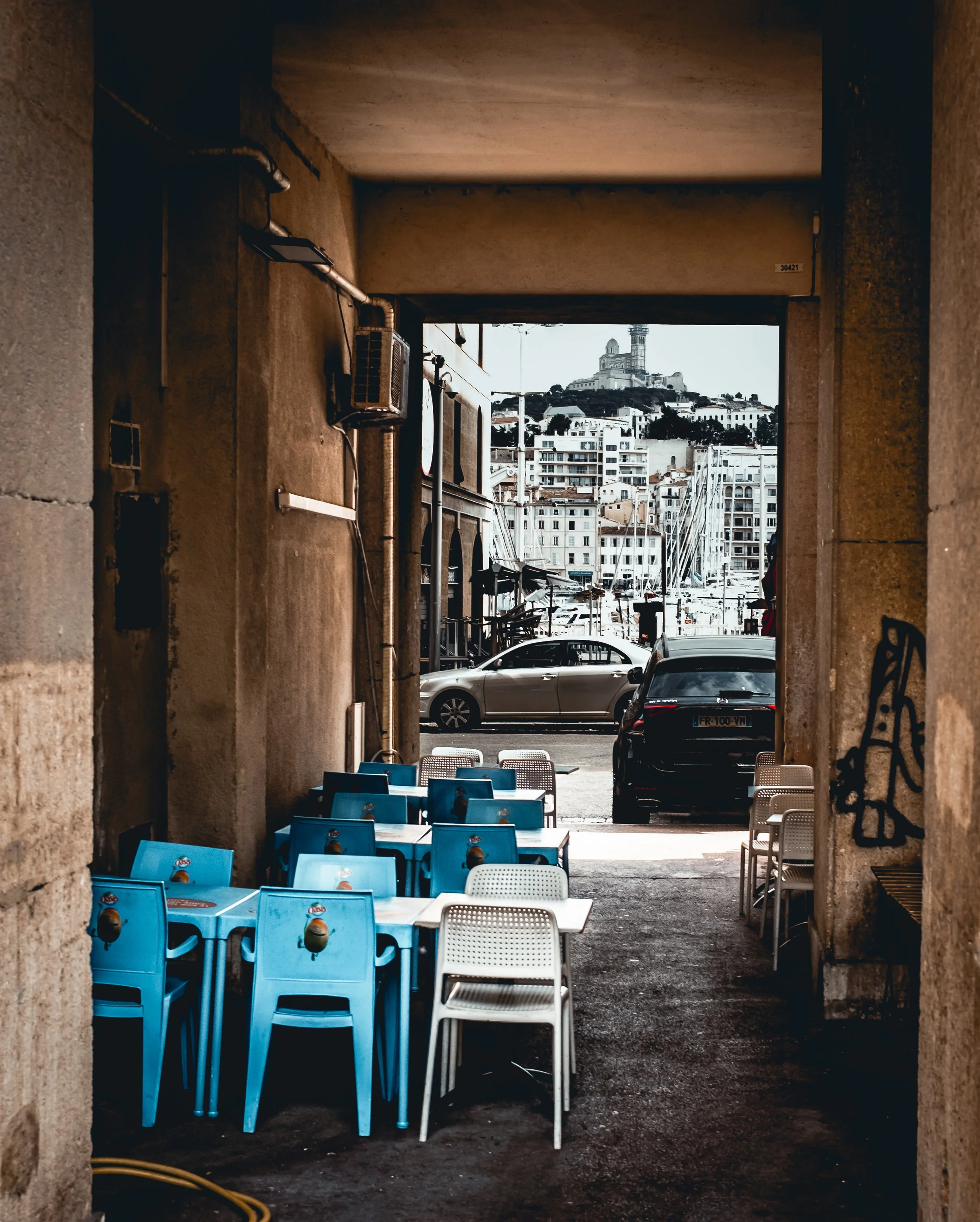 I love the layers in this photo, from the Cathedral in the background to the chairs in the foreground.