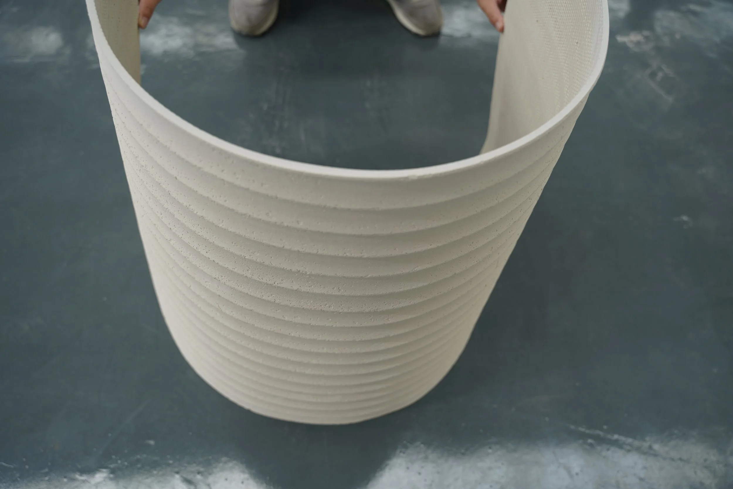 Engineering the Modern Penthouse: Strategic Weight-Saving with Flexible Stone Veneer vs. 2cm Slabs