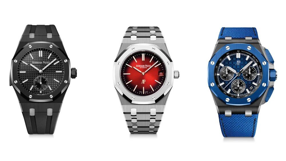 Three luxury watches with different designs and colors; black watch with rubber strap, silver watch with red dial, and blue chronograph watch with textile strap.