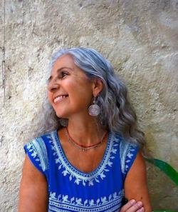 woman with gray hair and blue blouuse