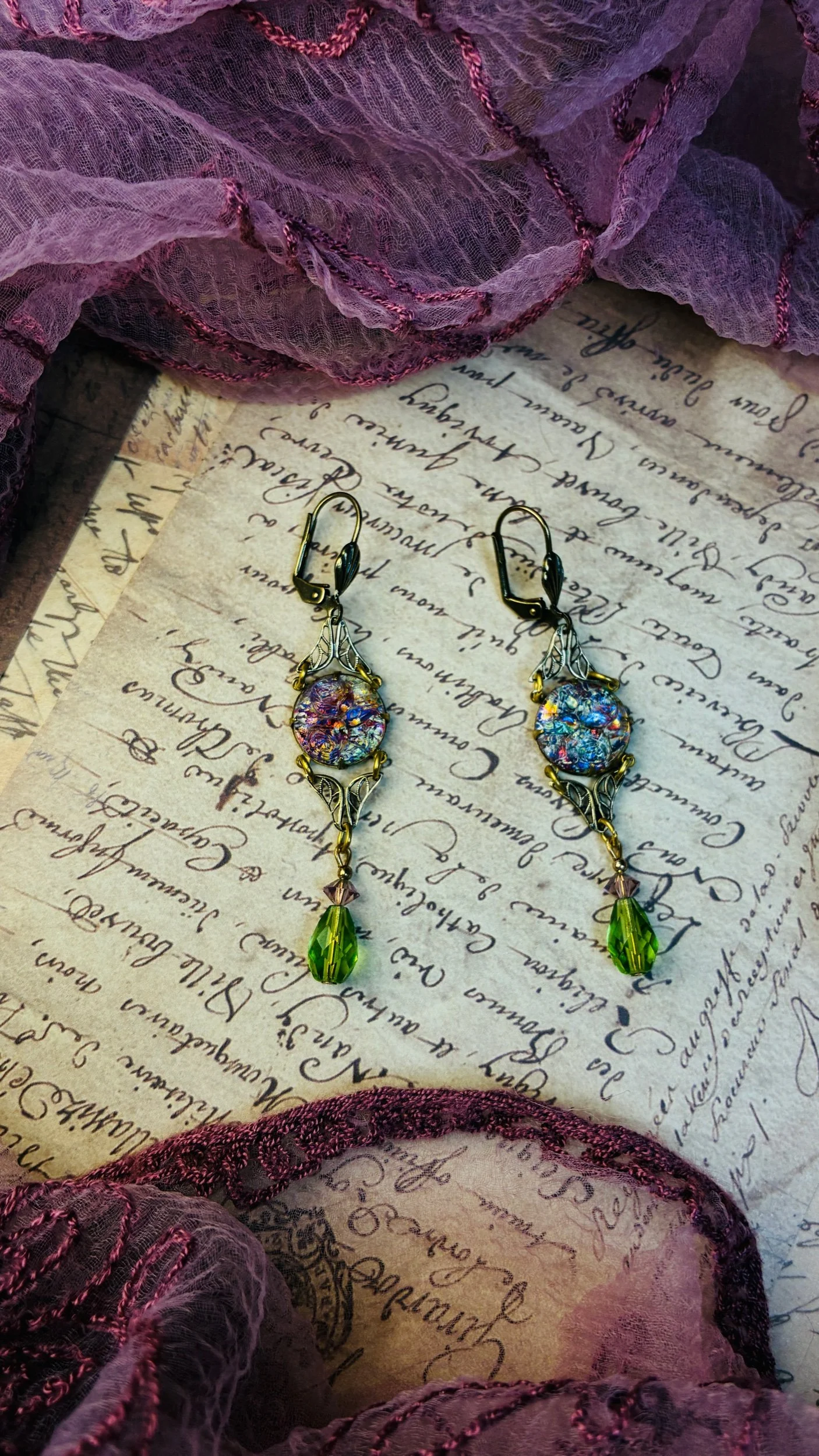 Velvet Reverie earrings in the Peridot colorway with green glass drops.