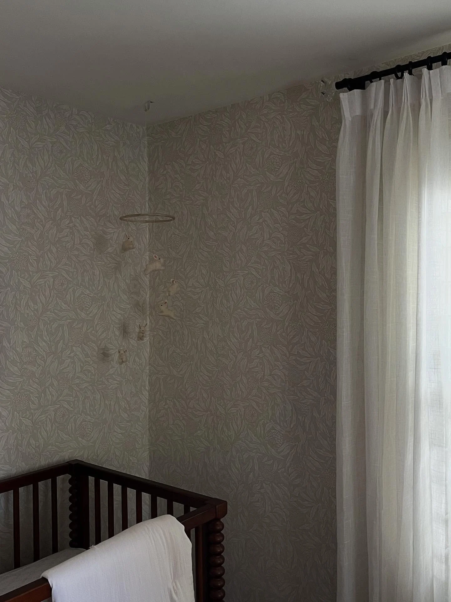 Nursery for a special client &amp; friend welcoming a baby girl next month is looking so pretty 🤍 
.
The wallpaper we landed on for this room totally transformed and softened the space. I love that it feels beautiful and feminine but can easily tran