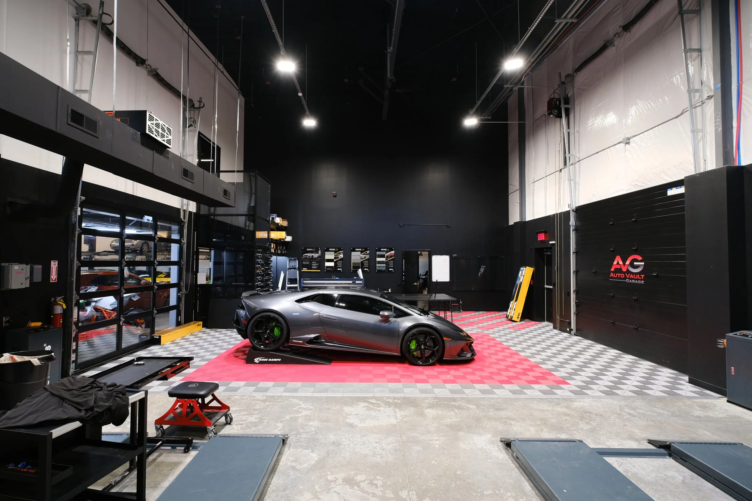 The Auto Vault Garage is a state-of-the-art car club, a first of its kind in Nashville, Tennessee. Inside, members can have their prized possessions detailed while enjoying the mezzanine lounge. The Auto Vault Garage by Gant Architectural Studio. Wil