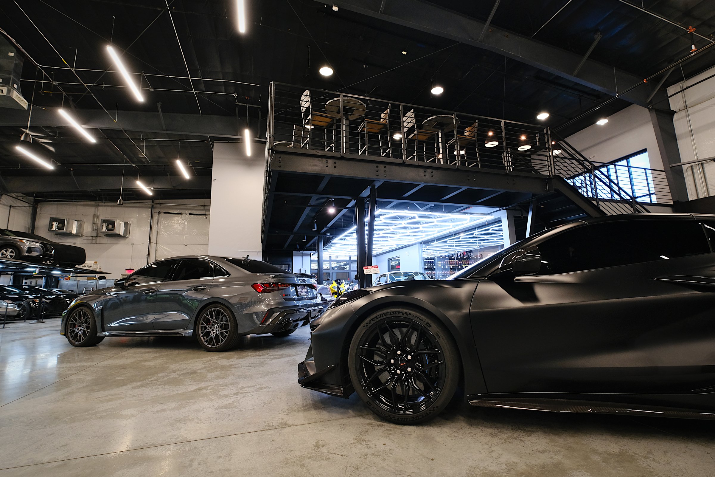The Auto Vault Garage is a state-of-the-art car club, a first of its kind in Nashville, Tennessee. Inside, members can have their prized possessions detailed while enjoying the mezzanine lounge. The Auto Vault Garage by Gant Architectural Studio. Wil