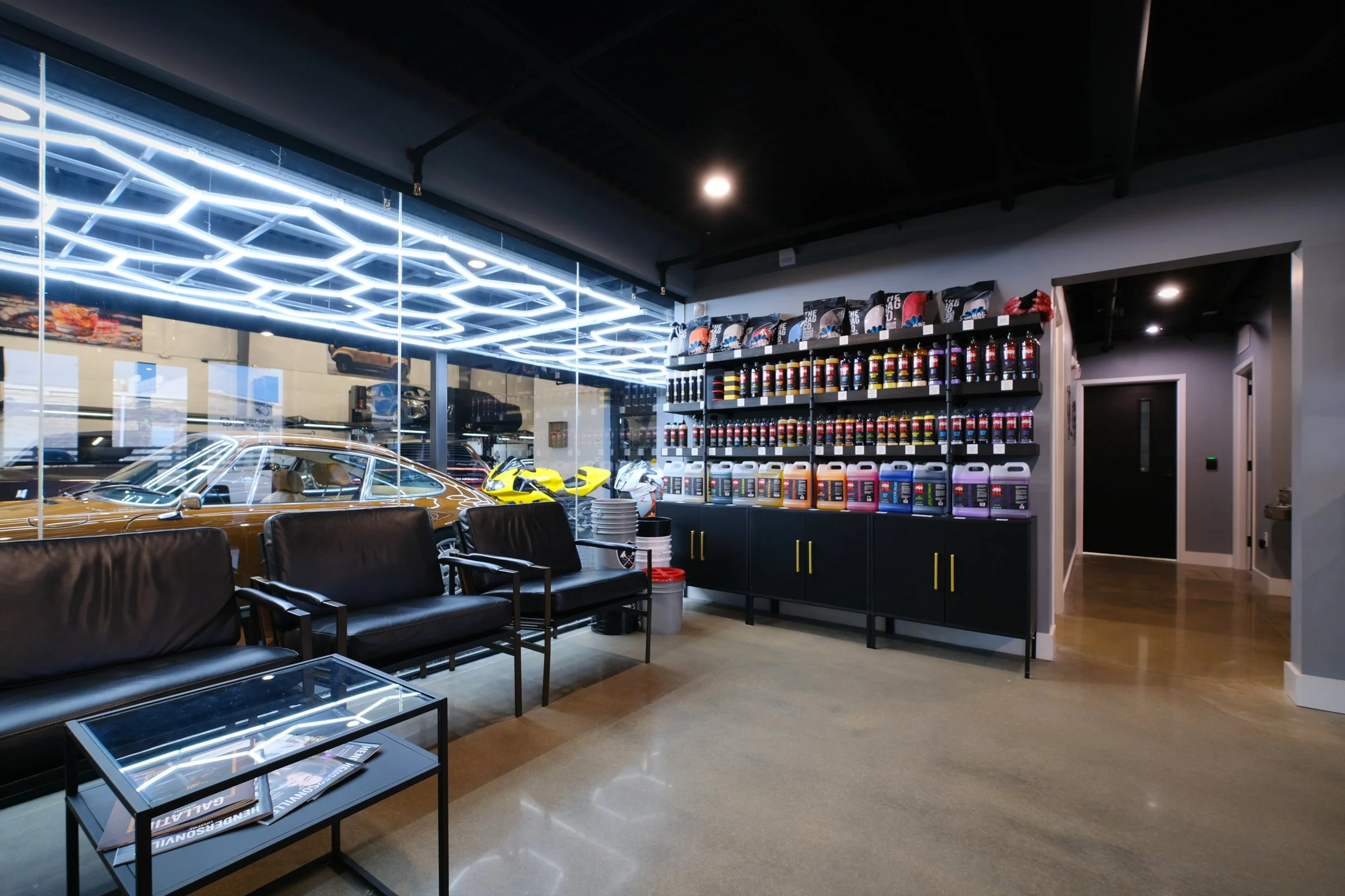 The Auto Vault Garage is a state-of-the-art car club, a first of its kind in Nashville, Tennessee. Inside, members can have their prized possessions detailed while enjoying the mezzanine lounge. The Auto Vault Garage by Gant Architectural Studio. Wil