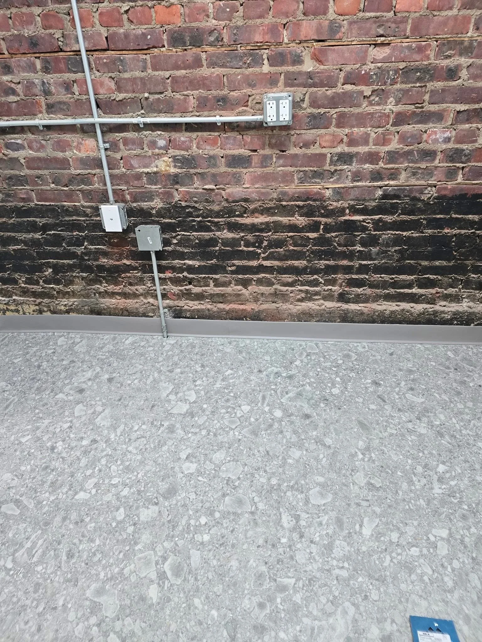 Spire Coffee Shop 
18”x 36” Floating Tile. Karndean Travertine Naturale Ceppo