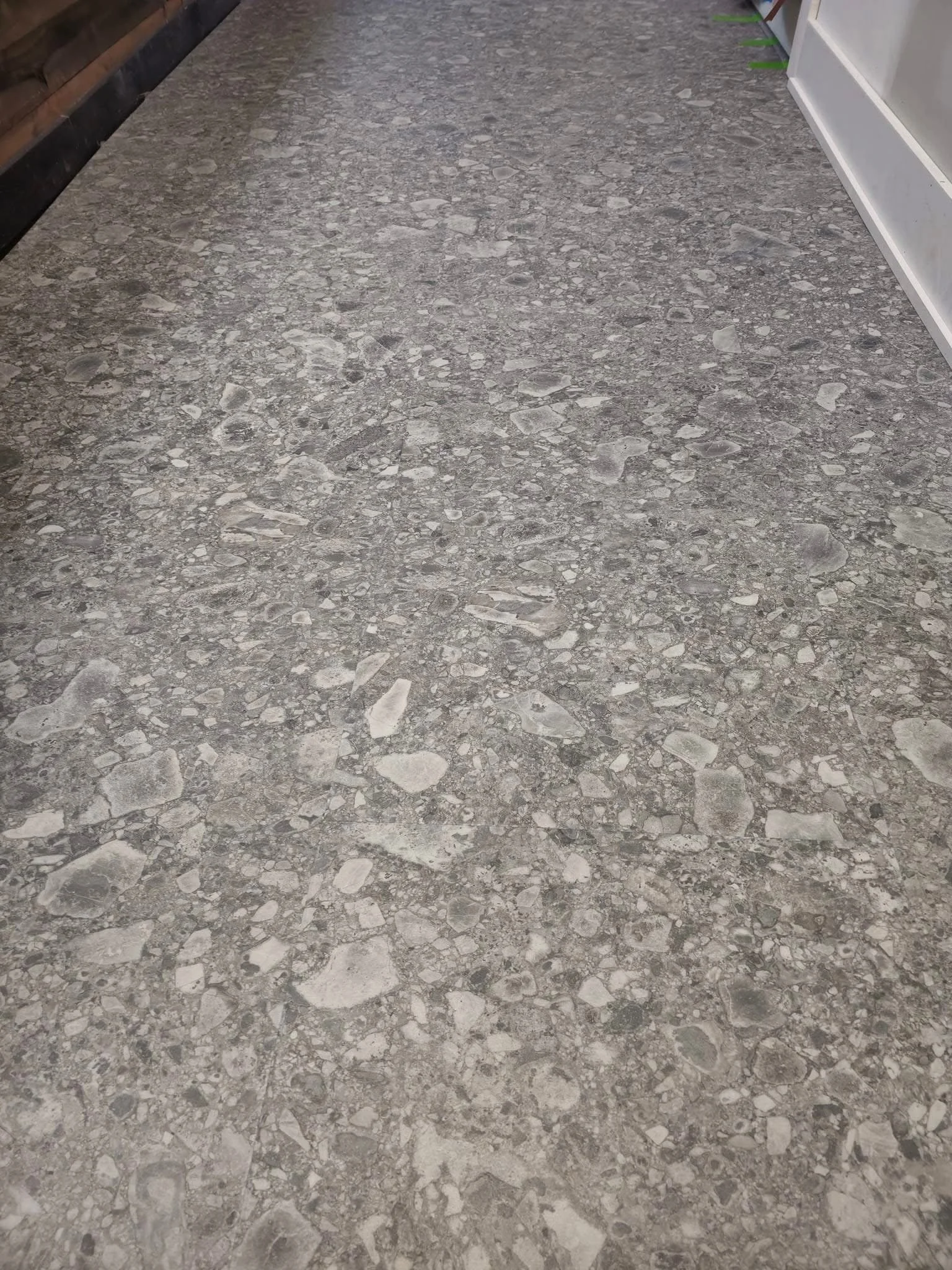 Spire Coffee Shop 
18”x 36” Floating Tile. Karndean Travertine Naturale Ceppo