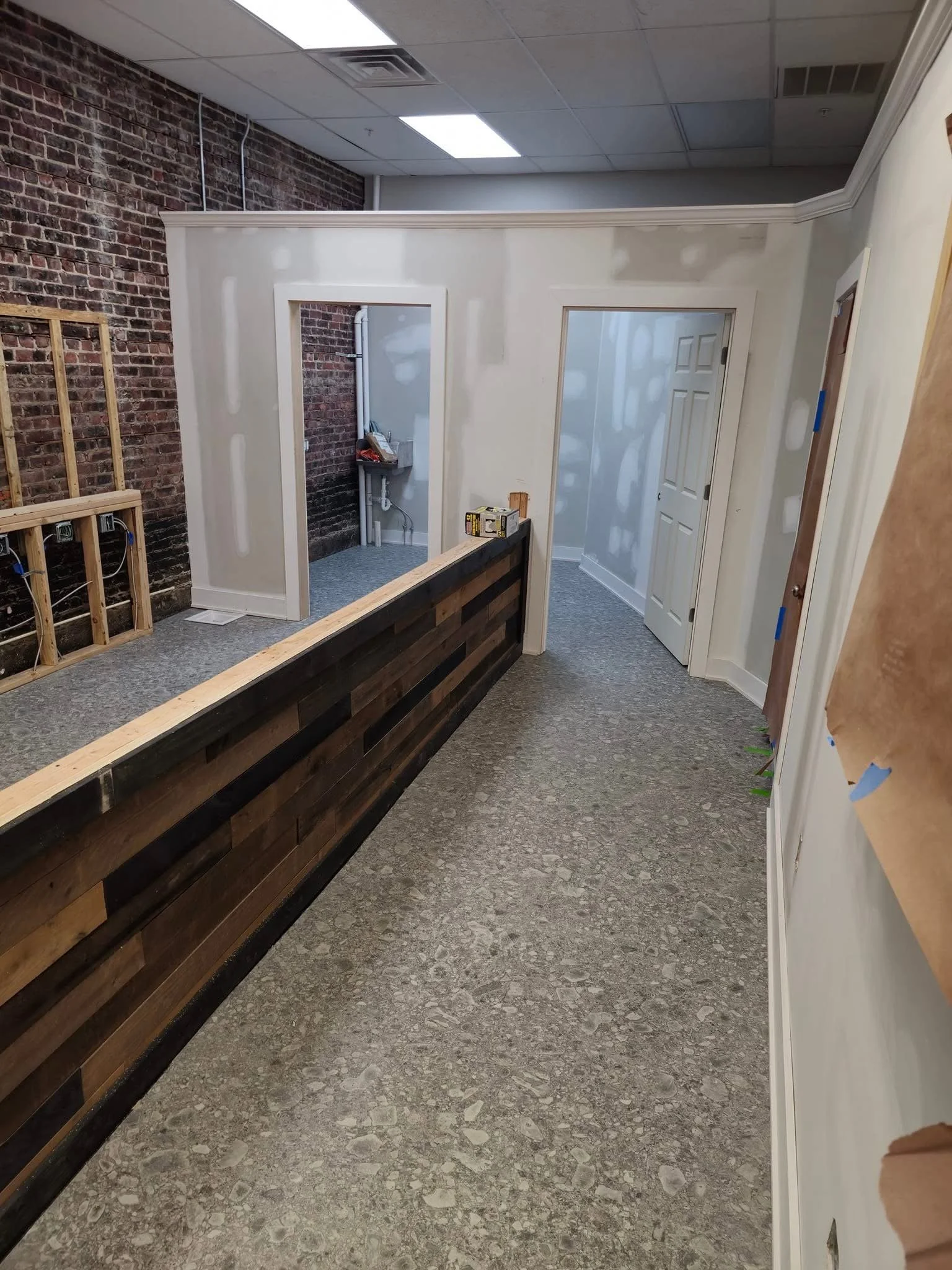 Spire Coffee Shop 
18”x 36” Floating Tile. Karndean Travertine Naturale Ceppo