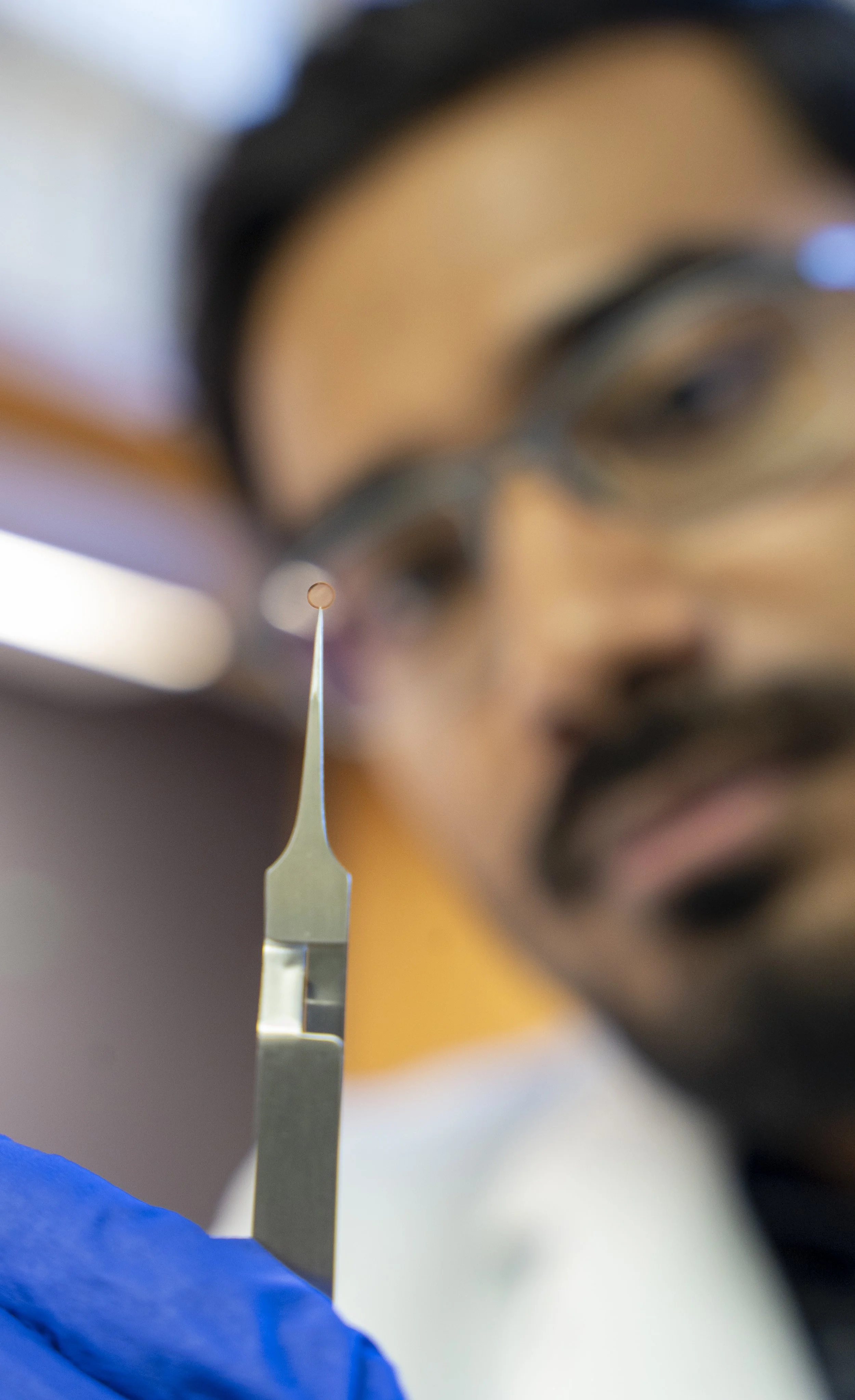 Himanshu holding an EM grid