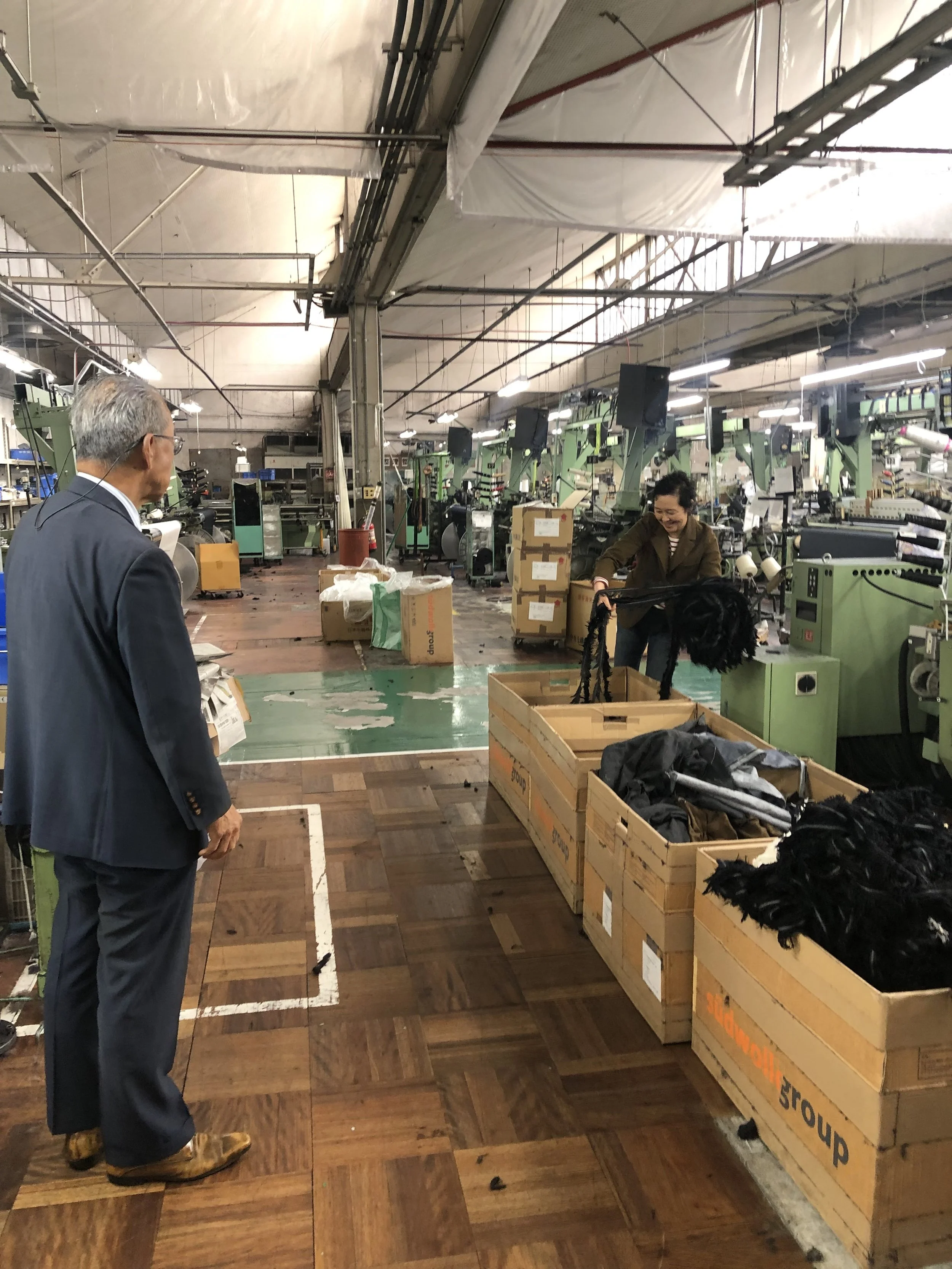 Salvaging materials from the active weaving factory in Ichinomiya