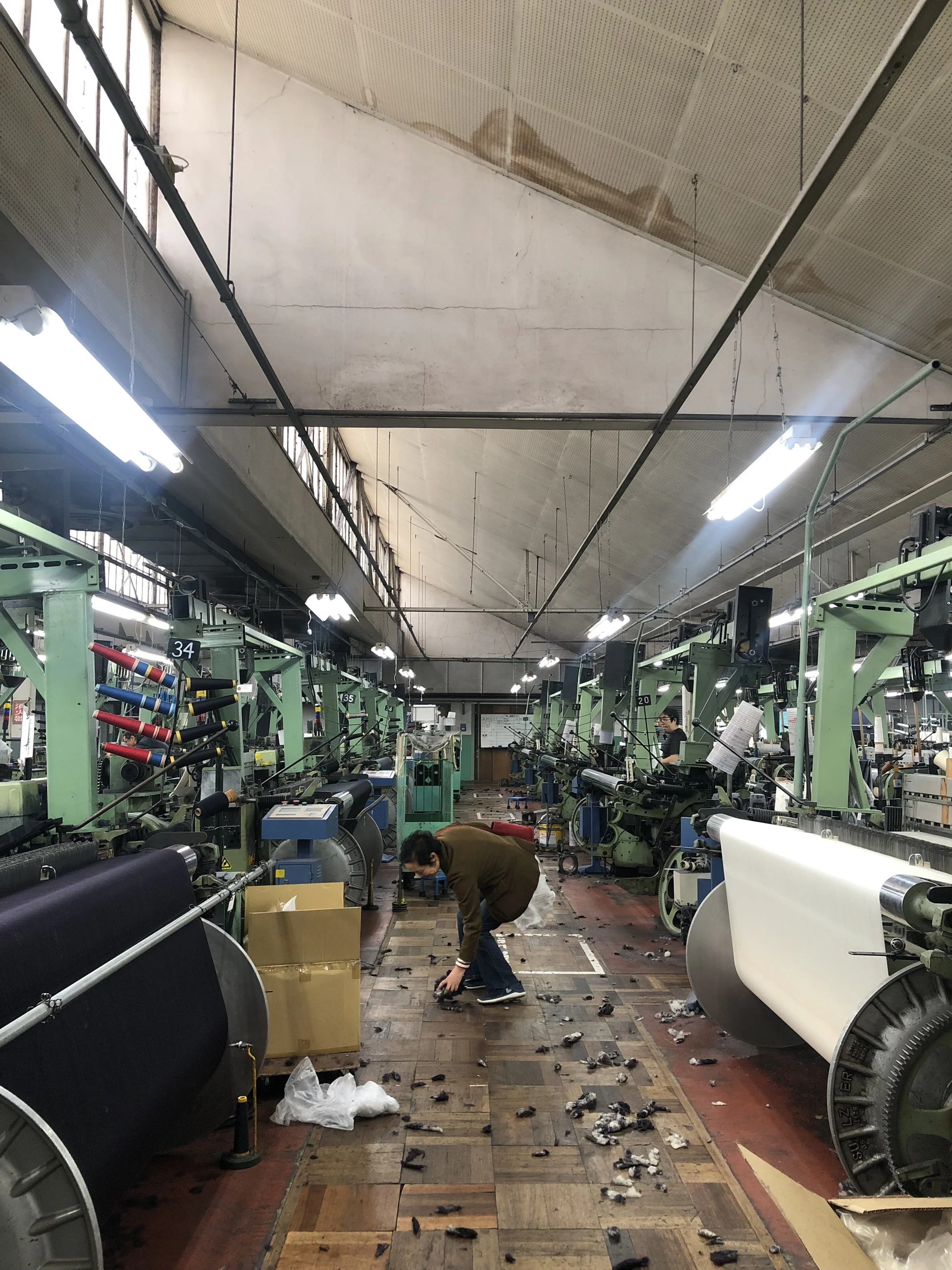 Salvaging materials from the active weaving factory in Ichinomiya