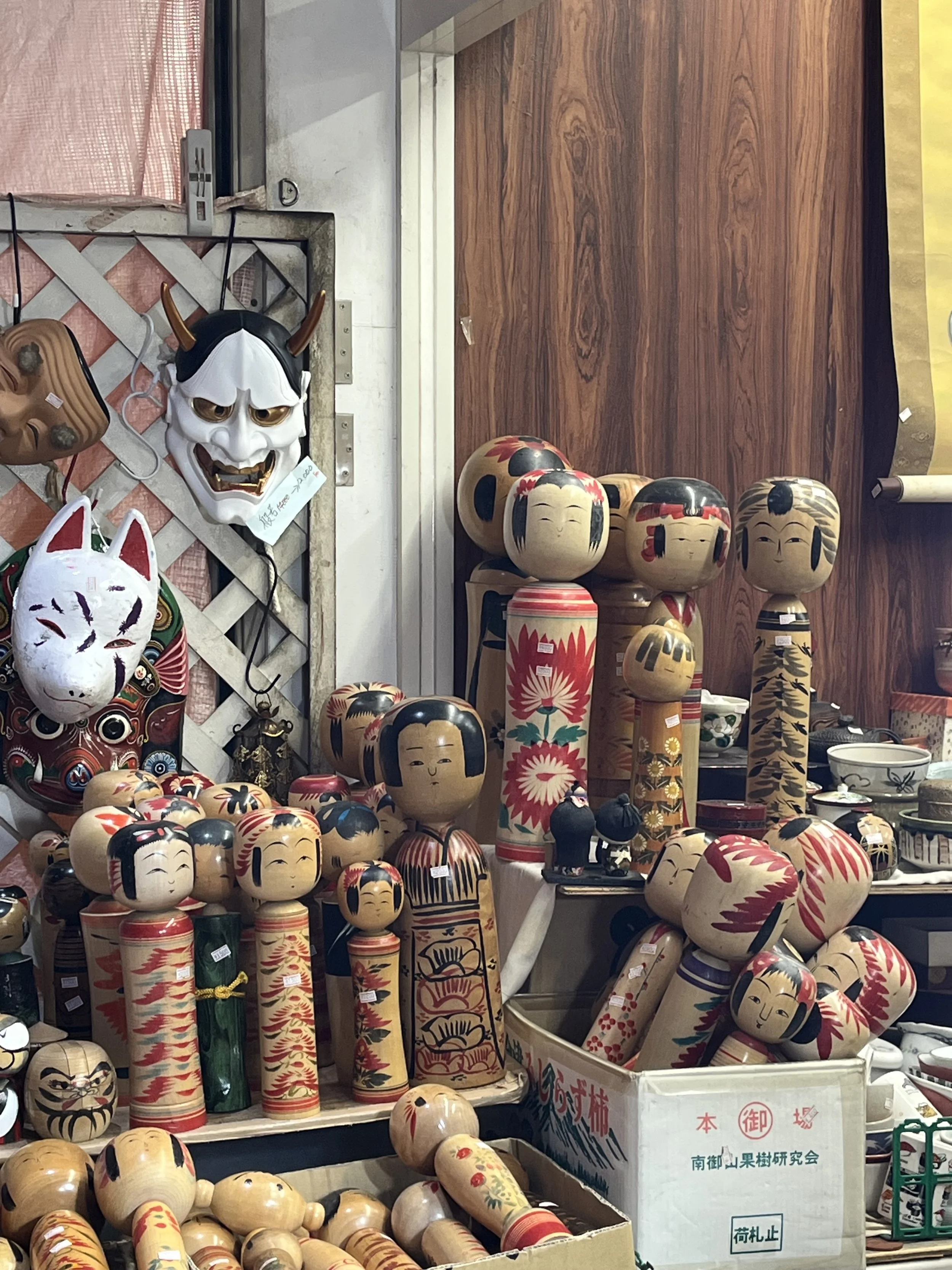 "Kokeshi Dolls" are traditional, handcrafted wooden dolls with 150 years of history, characterized by a simple, limbless cylindrical body and a round head, symbolizing good luck.