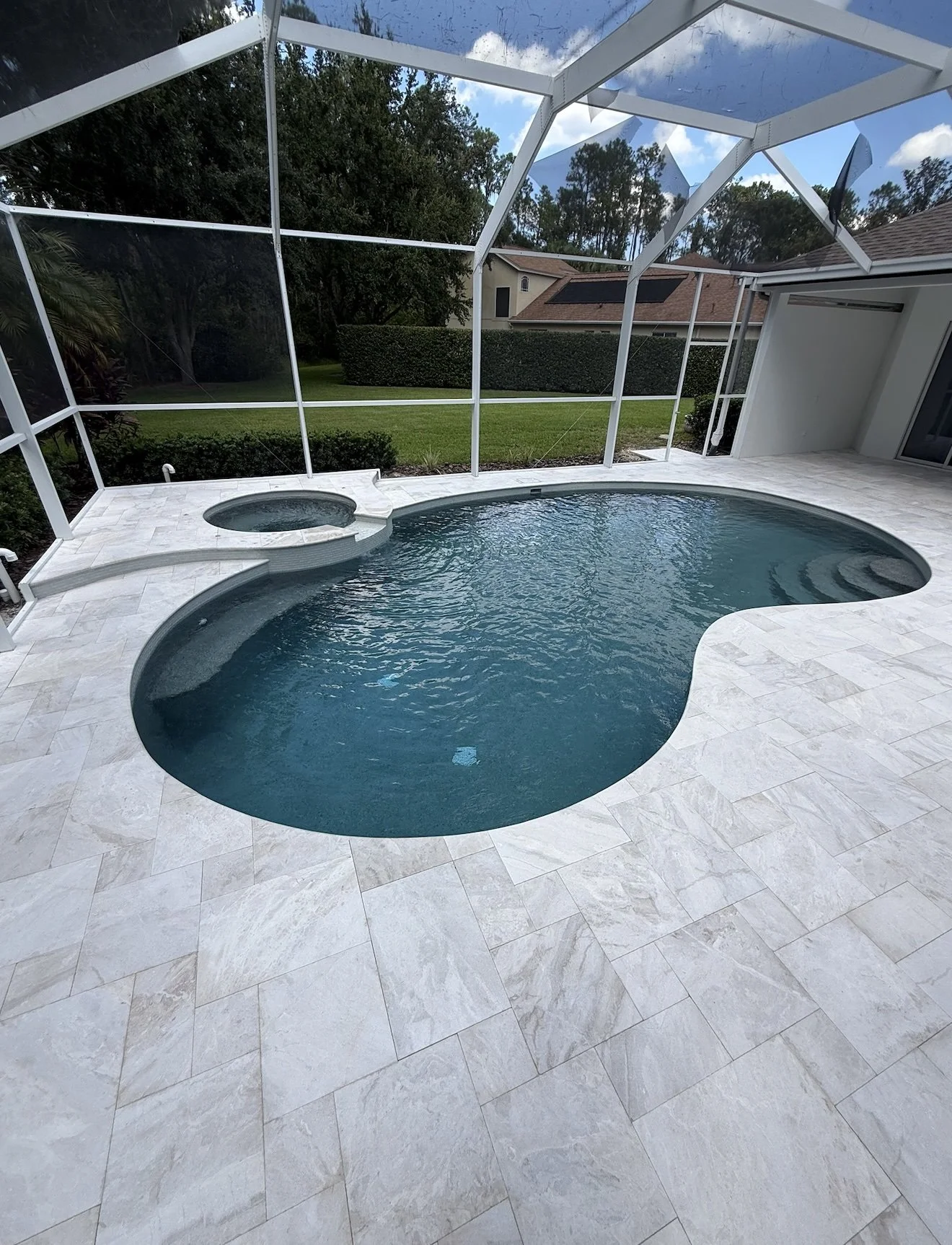 PebbleSheen French Gray with Dianna Royal Marble Infinity Coping and French Pattern Pavers