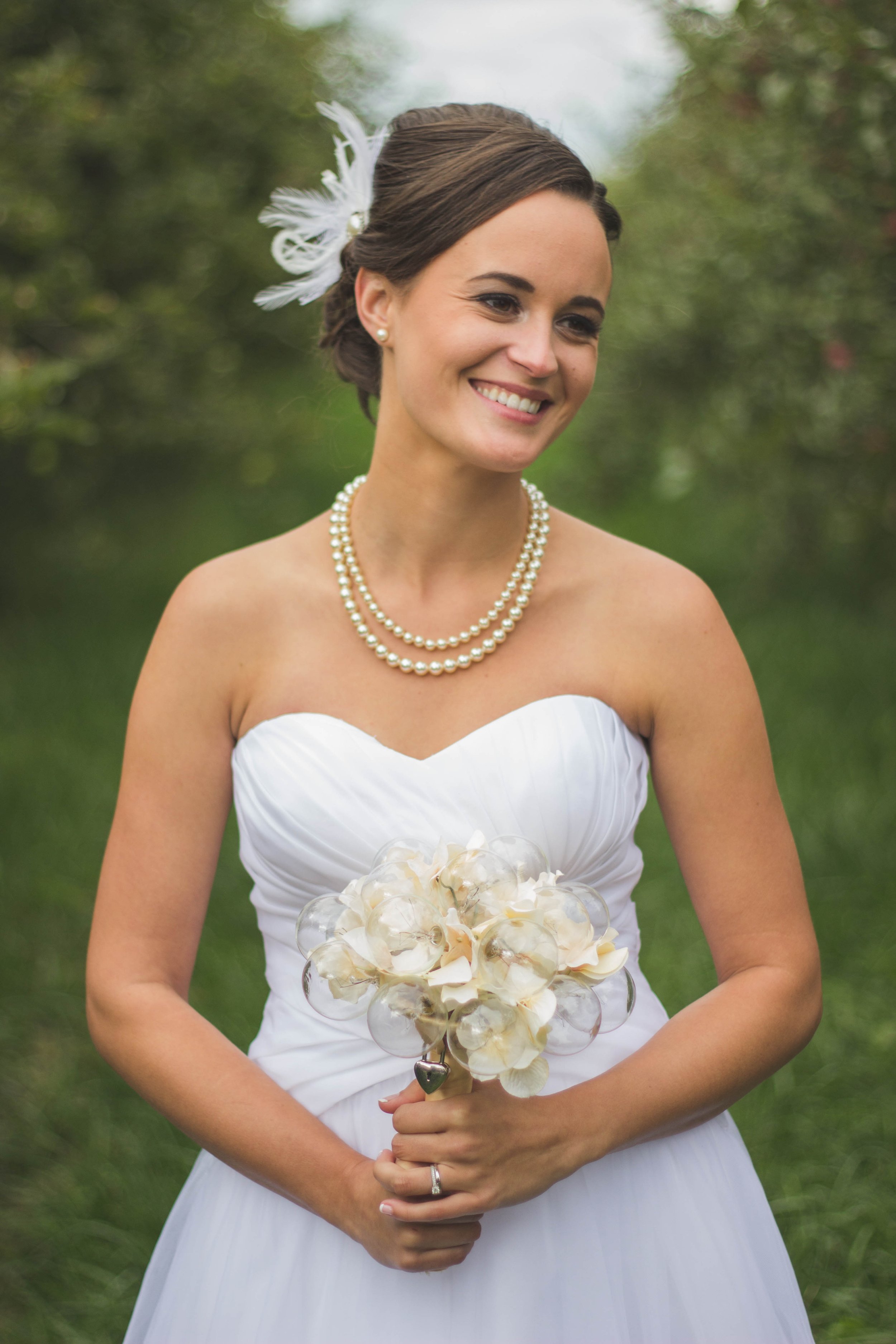 Bride getting ready before her beautiful wedding pearl necklace