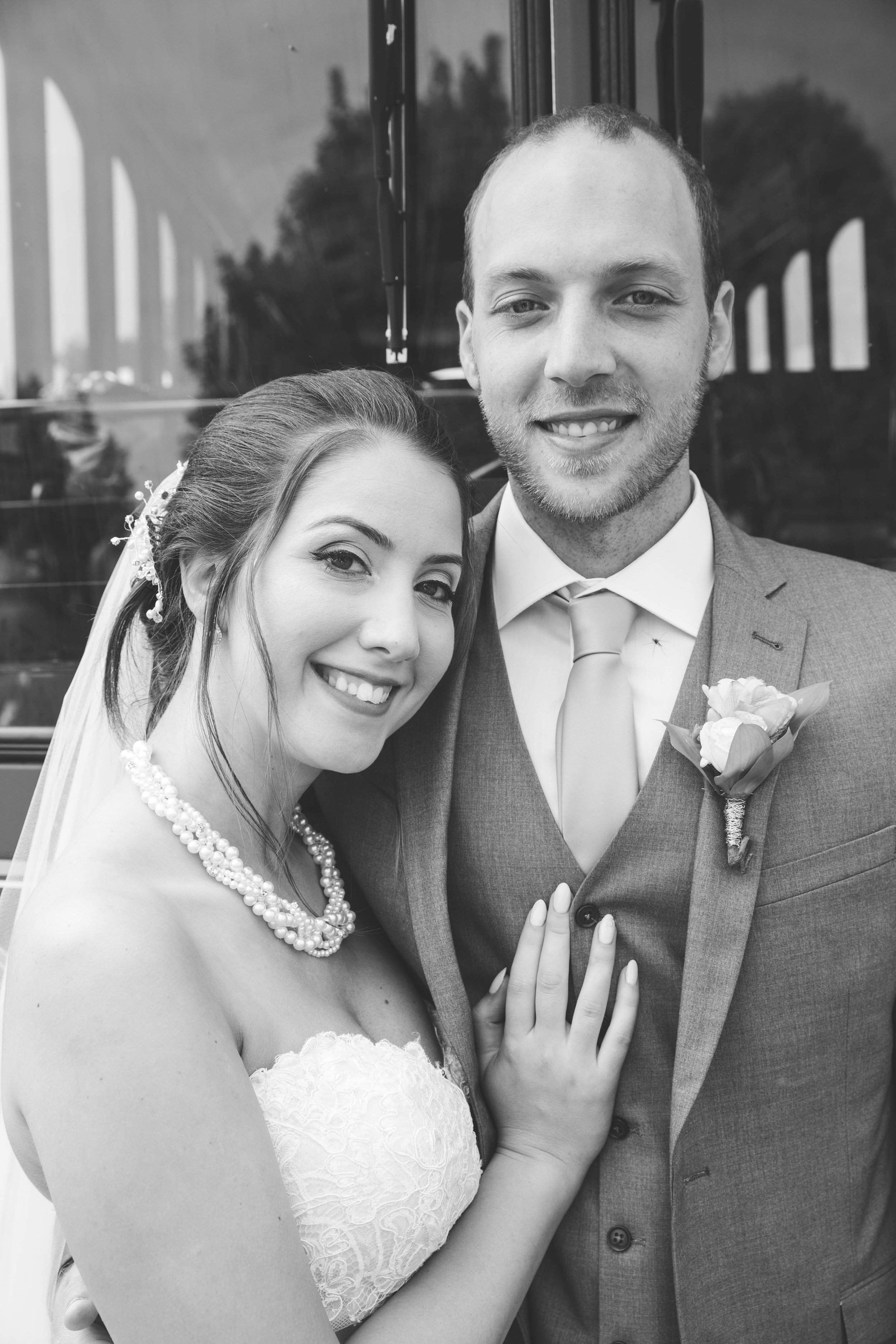 Bride and groom in love during their beautiful outdoor wedding