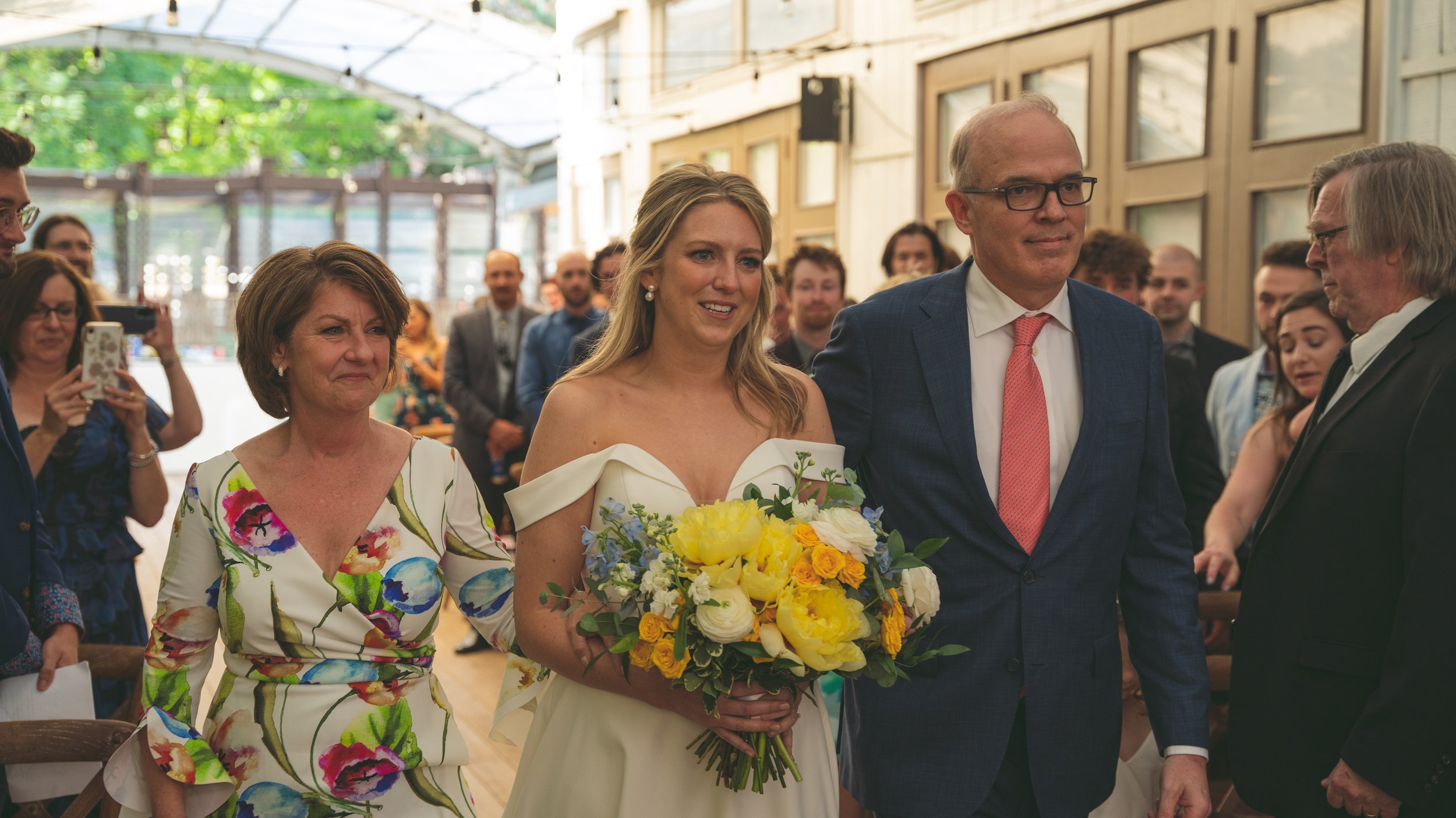 Bride coming down the isle at her beautiful outdoor wedding