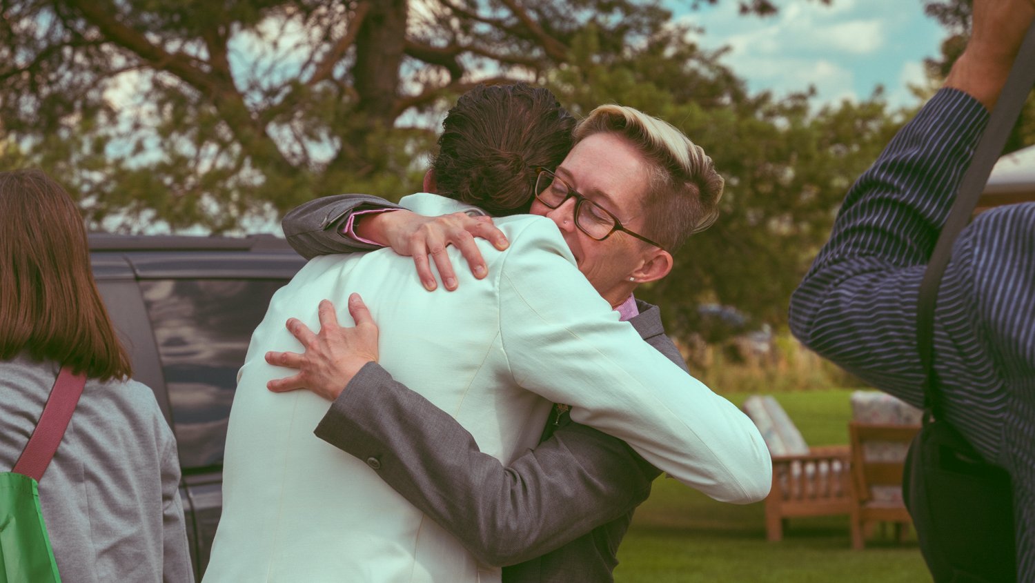 candid moment beautiful wedding hug