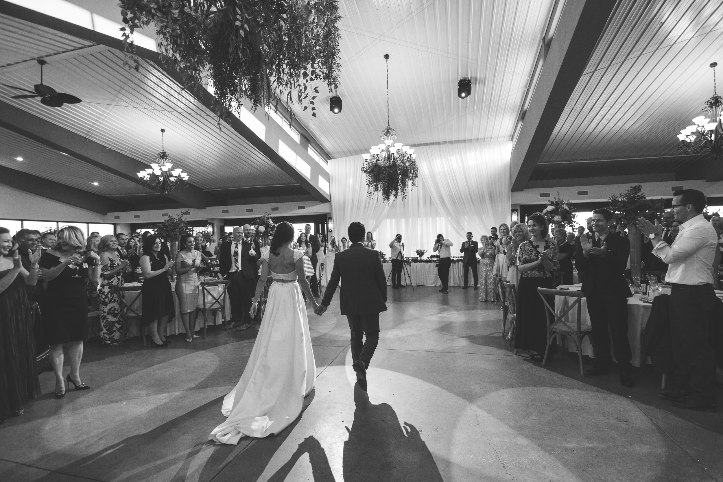 bride and groom entering their beautiful wedding
