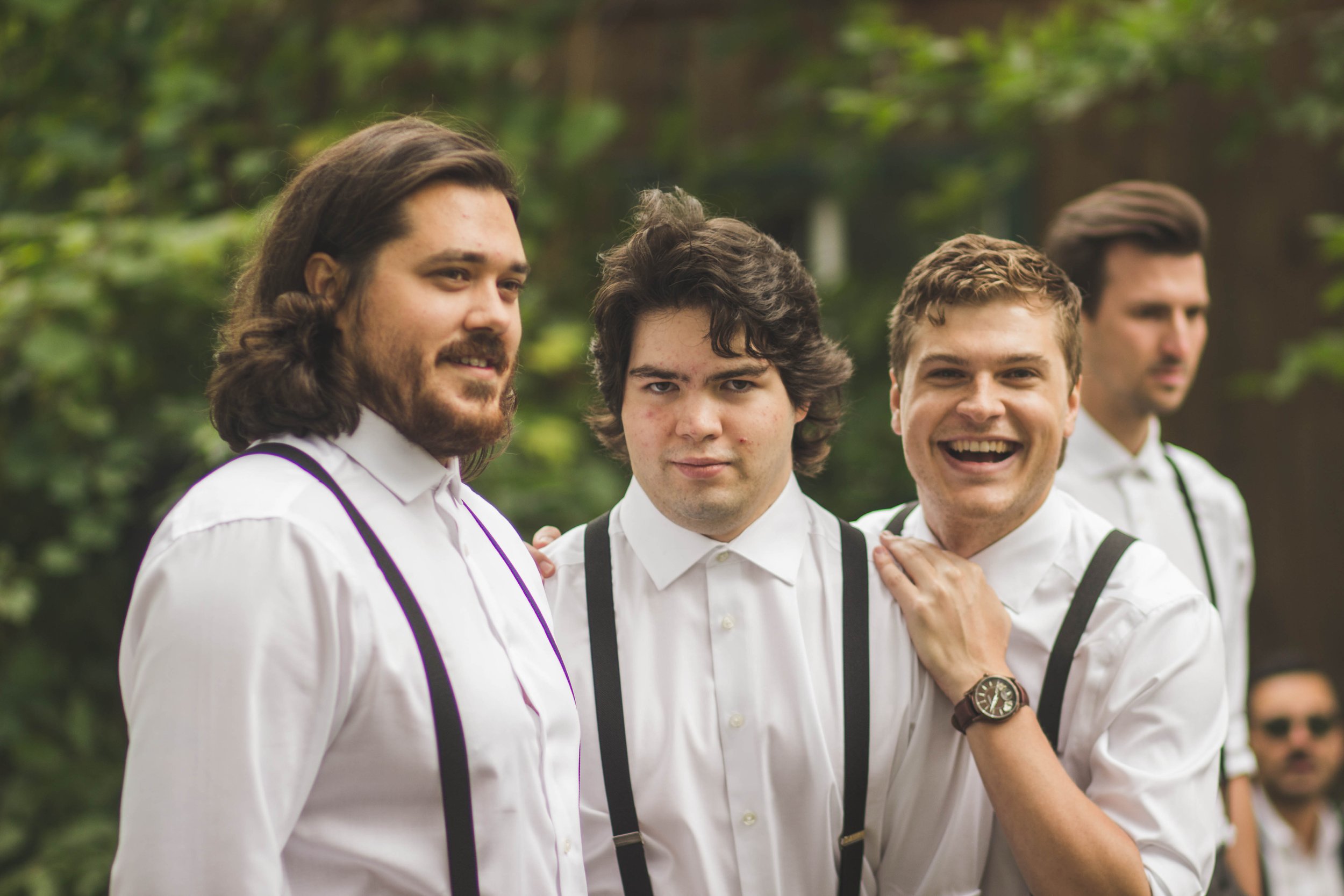 groomsmen sharing a laugh before the beautiful wedding