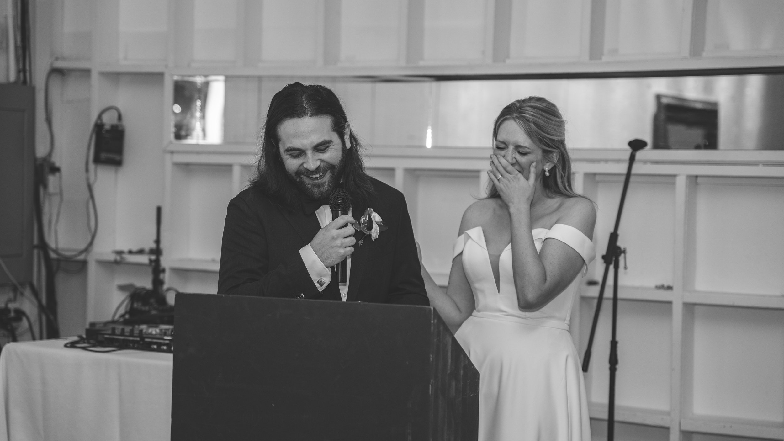beautiful wedding reception. laughs and fun. wedding speech bride and groom in love