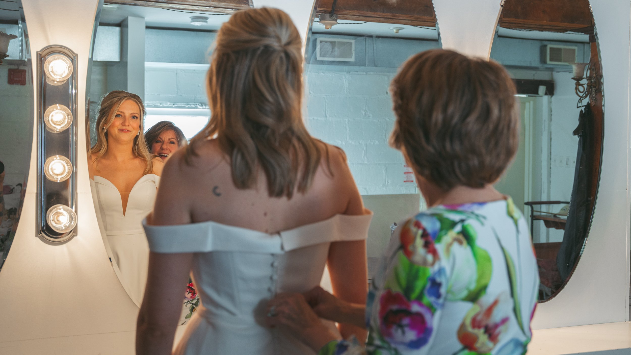 Getting ready with the bride on her beautiful wedding day. brides mom.