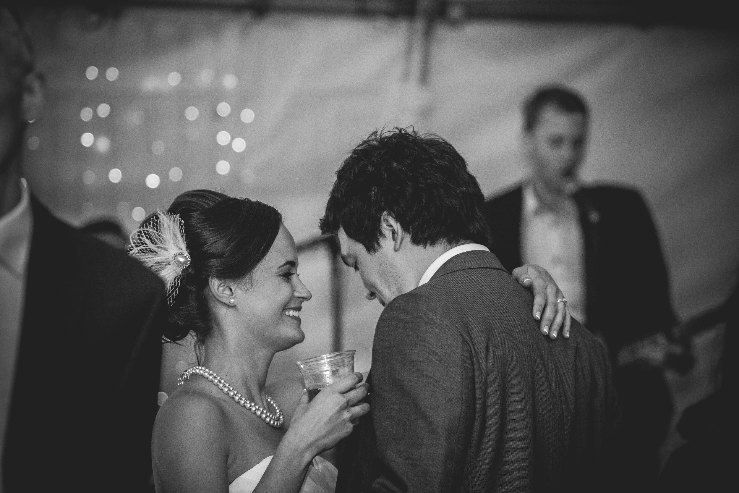 bride and groom in love taking a candid photo during their beautiful wedding first dance