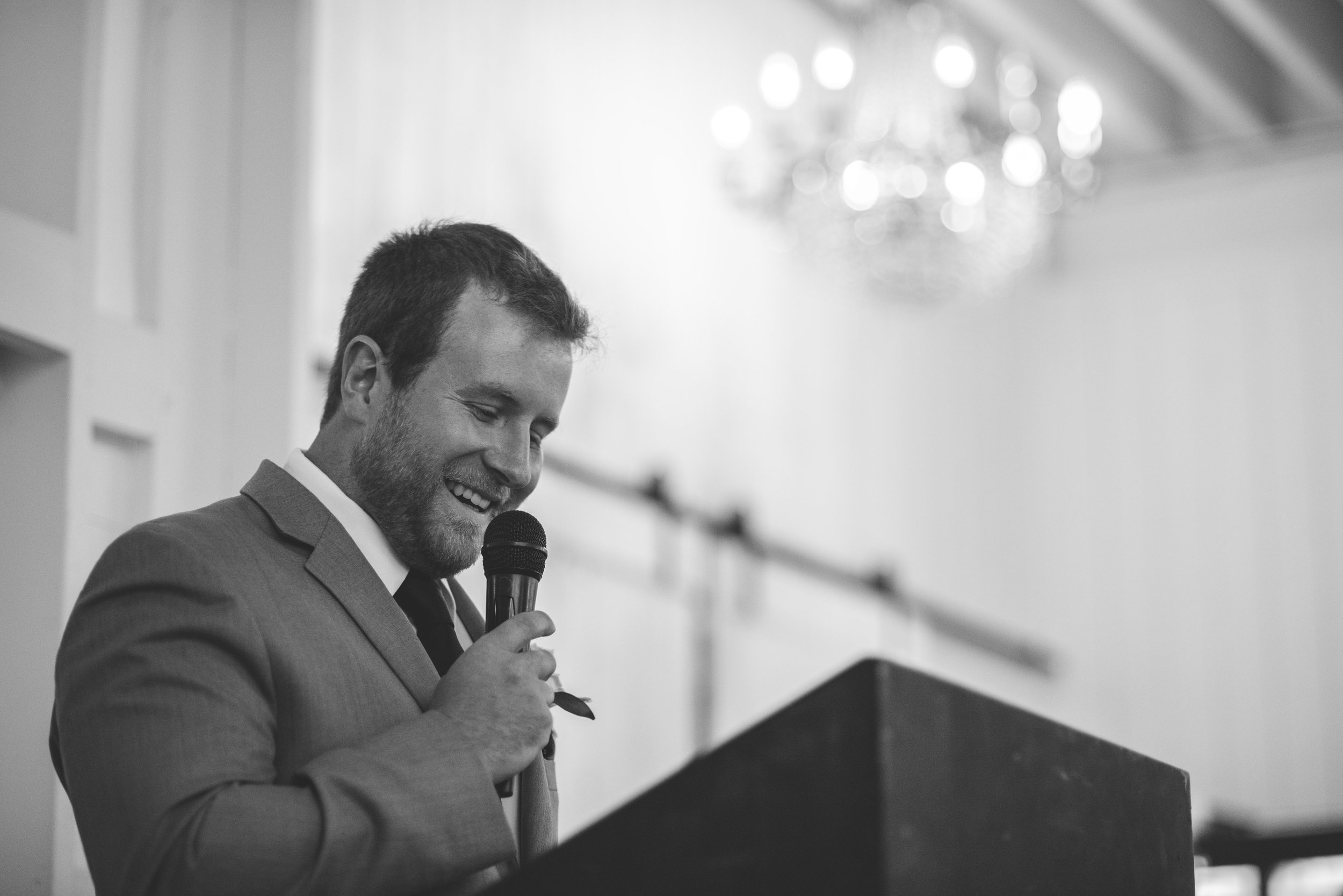 beautiful wedding reception. laughs and fun. wedding speech bride and groom in love