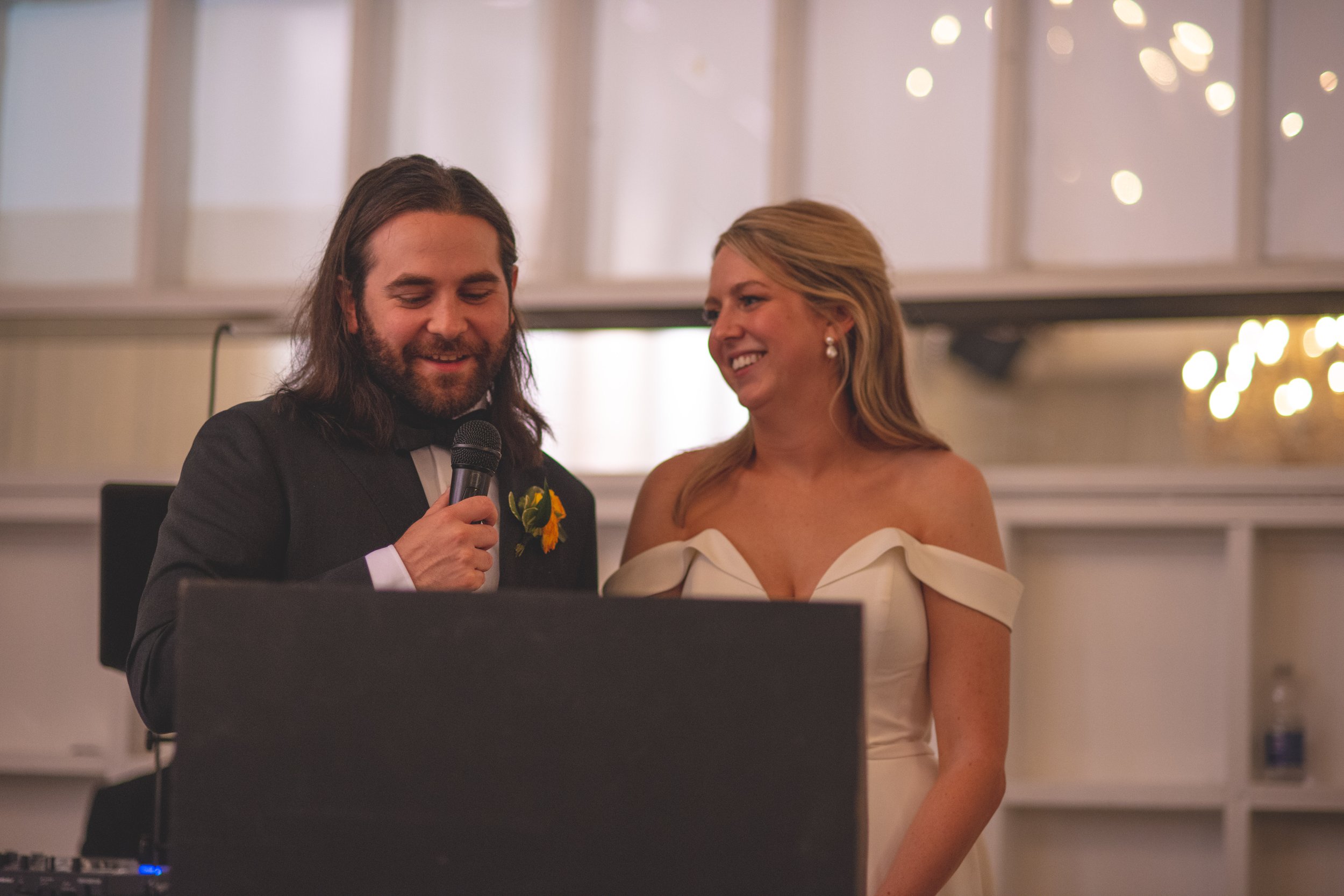 beautiful wedding reception. laughs and fun. wedding speech bride and groom in love
