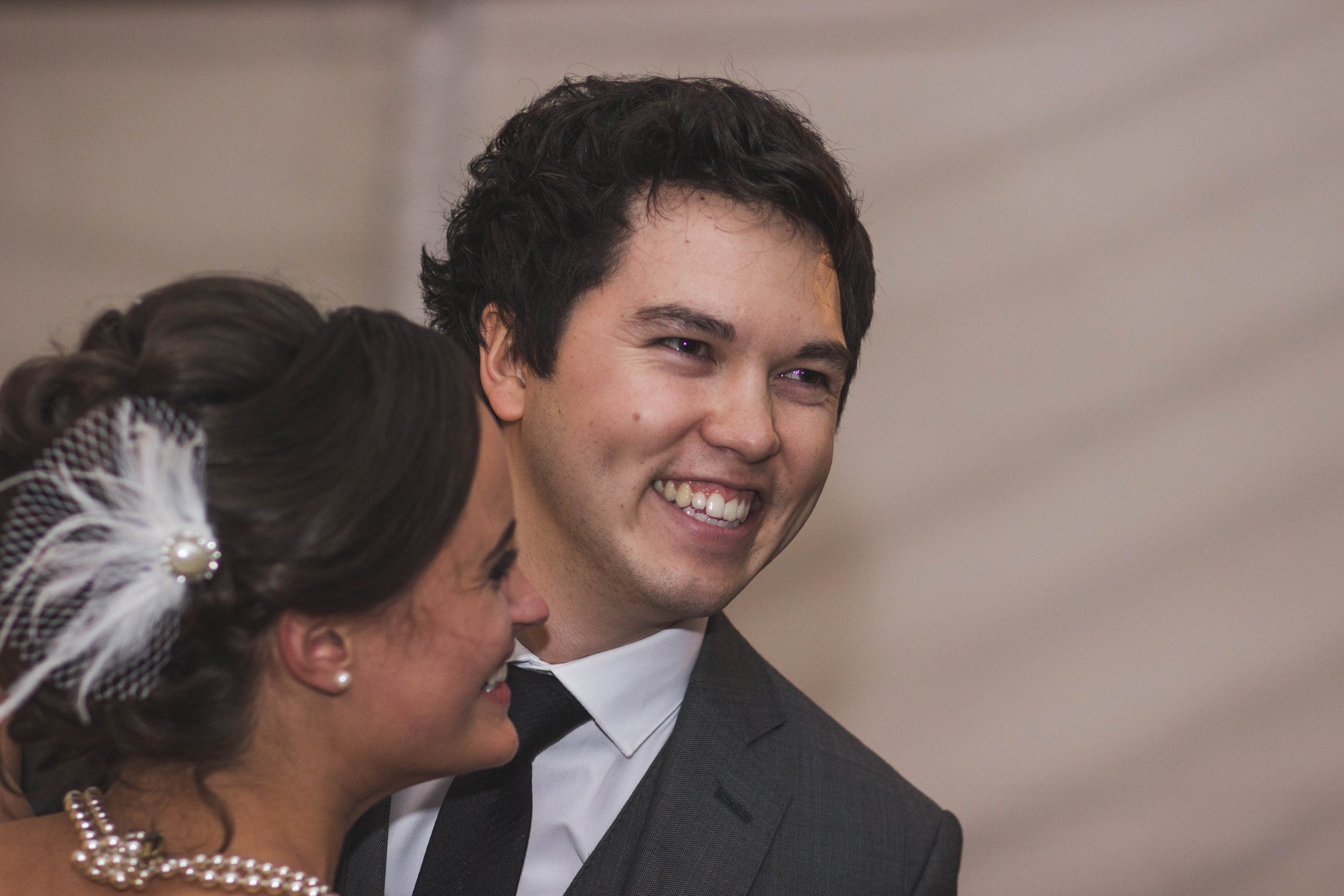 bride and groom in love taking a candid photo during their beautiful wedding first dance