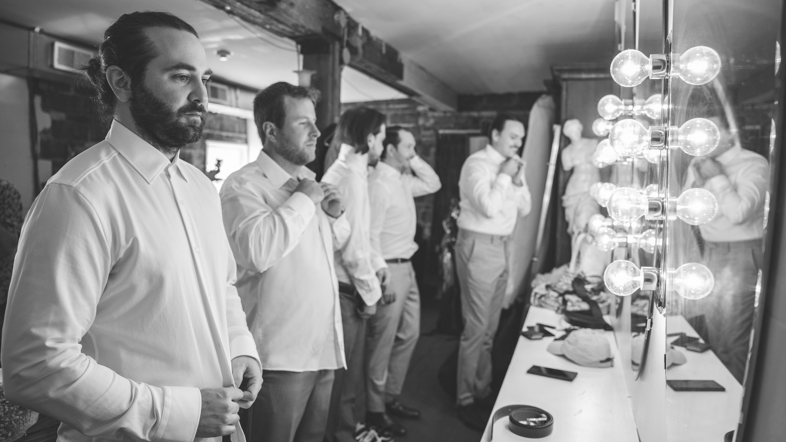 Getting ready with the groom and his groomsmen.