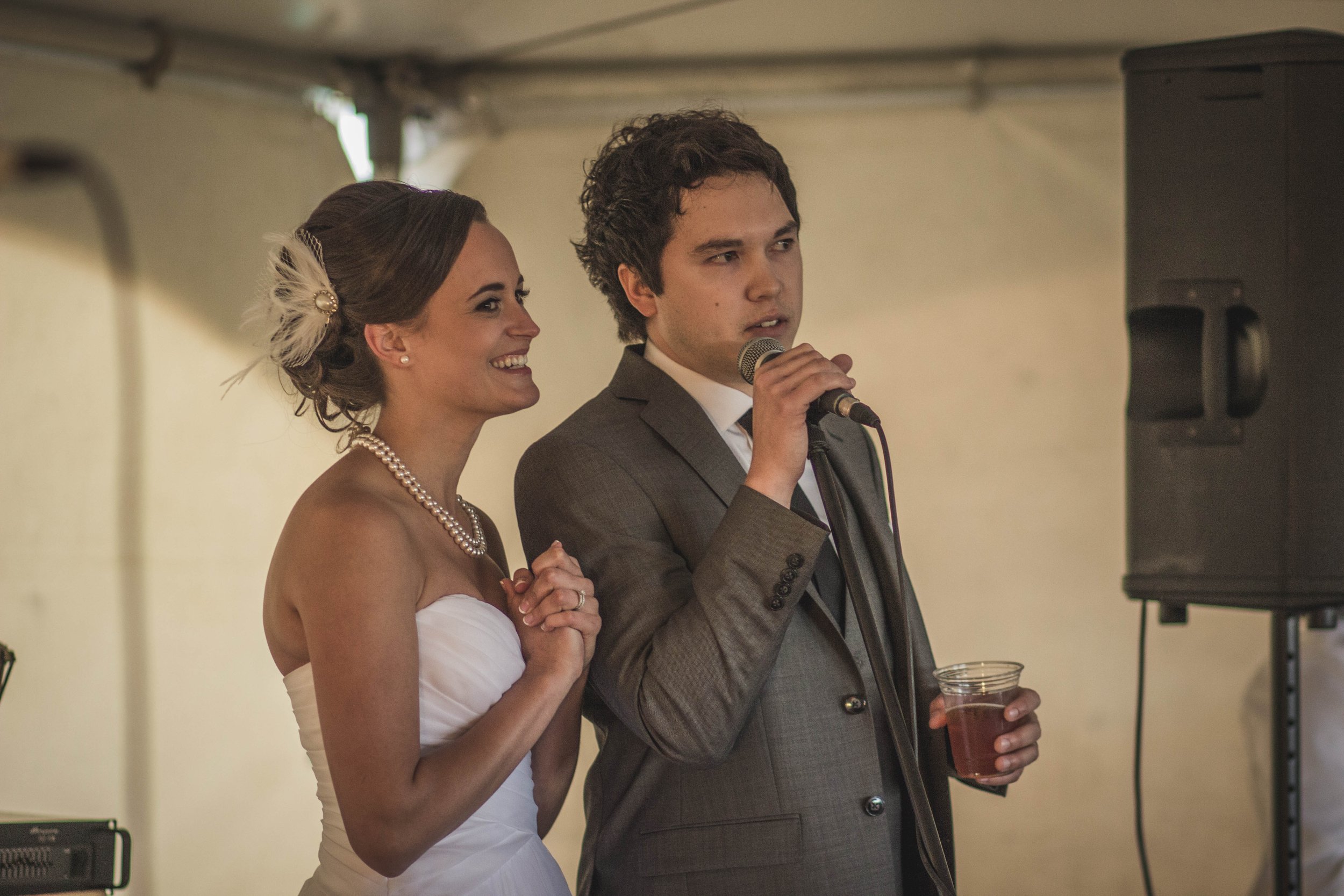 bride and groom in love taking a candid photo during their beautiful wedding wedding speech