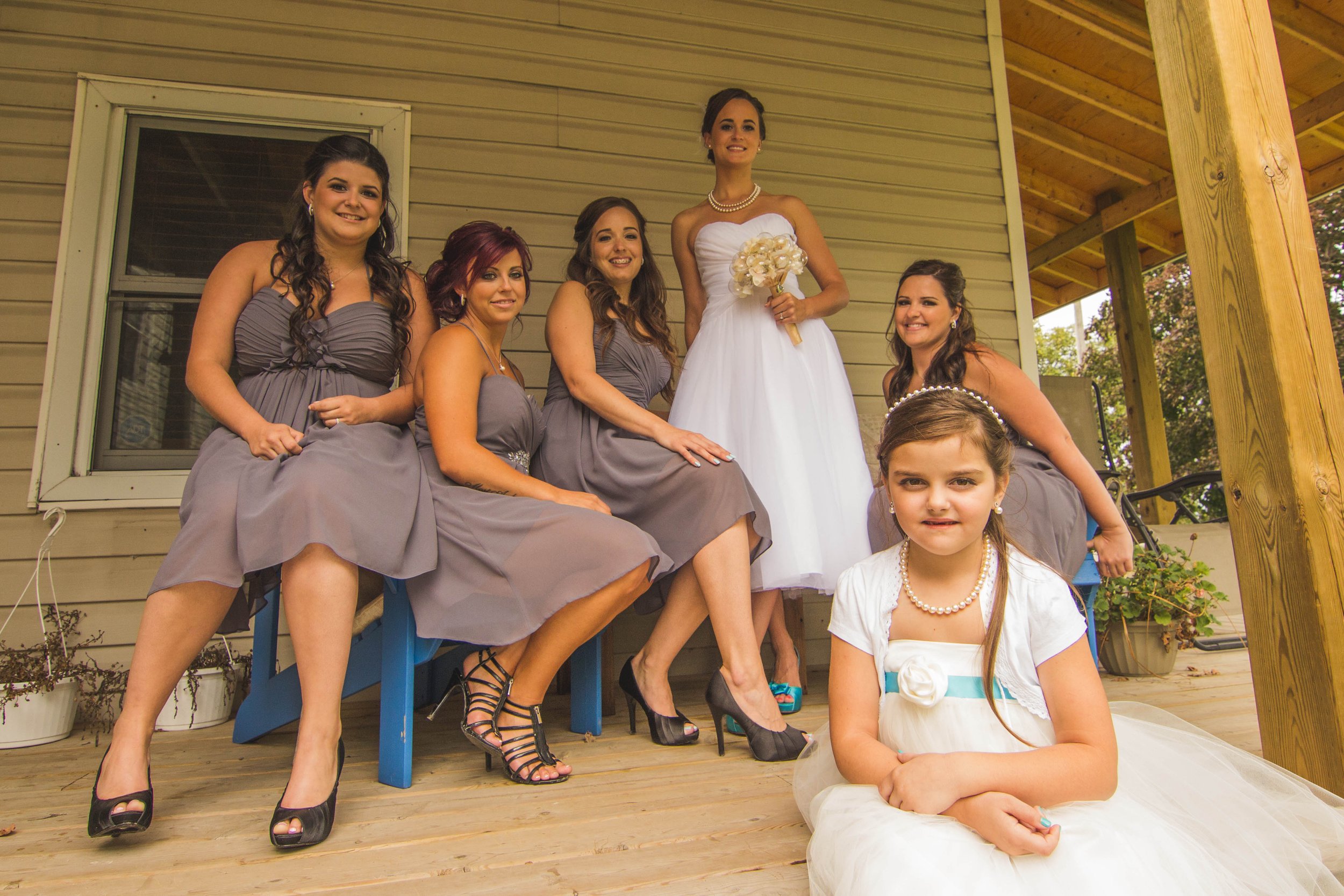 Bridesmaid group photo before beautiful wedding pearl necklace