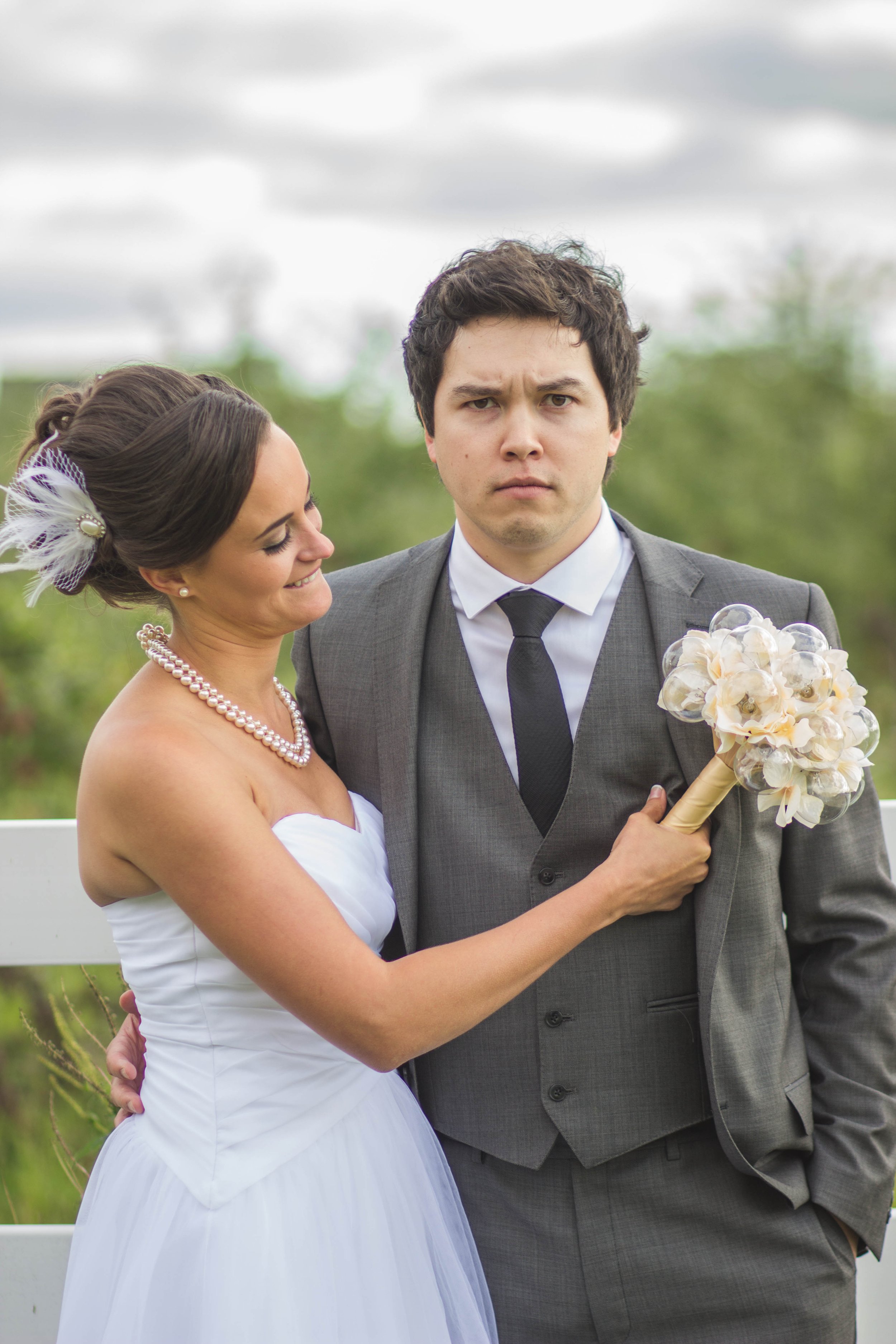 bride and groom in love taking a candid photo during their beautiful wedding