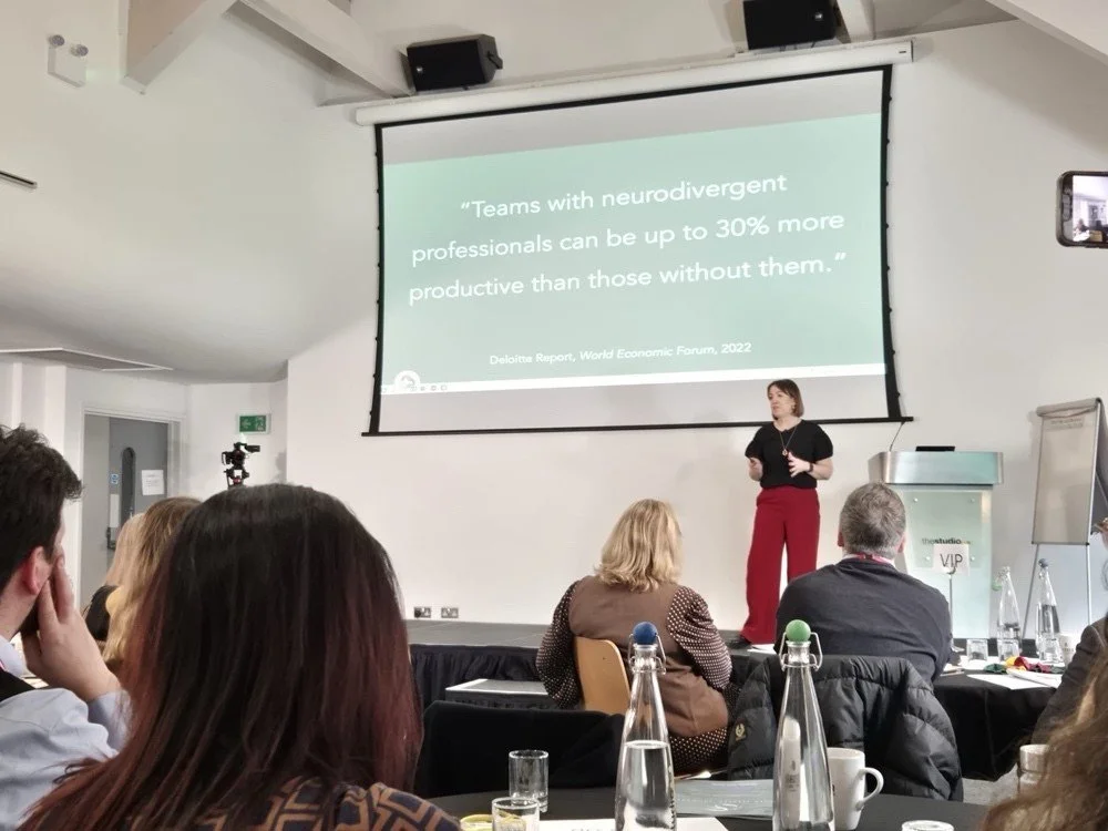 Kerry Bentley delivering neurodivergent training to a group of people in the workplace