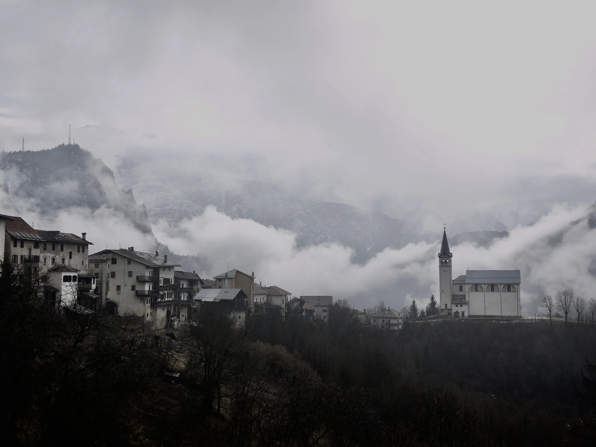 Longarone village in the clouds with church