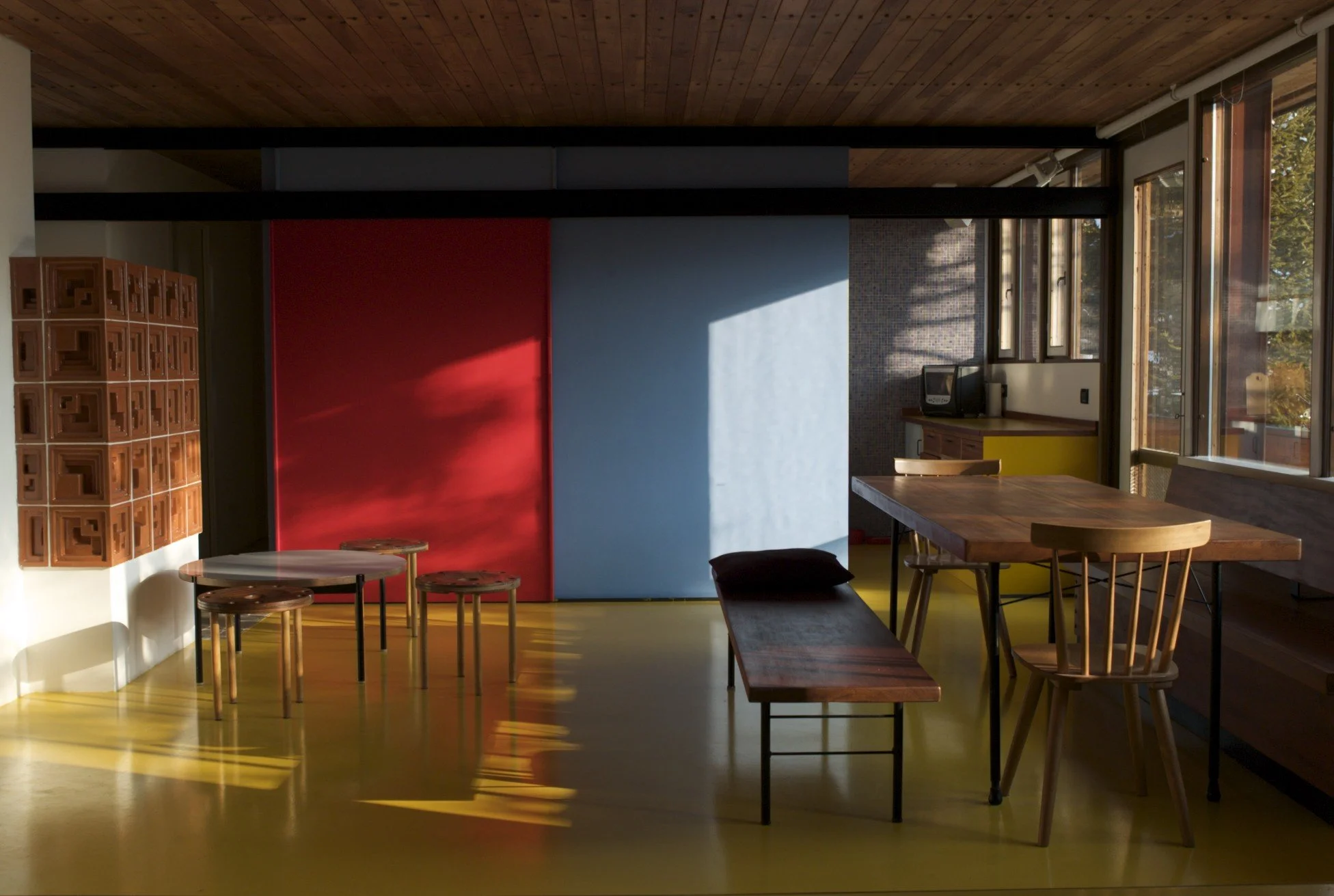Colorful interiors designed by Edorda Gellner in one of the chalets of Villaggio ENI in Borca di Cadore