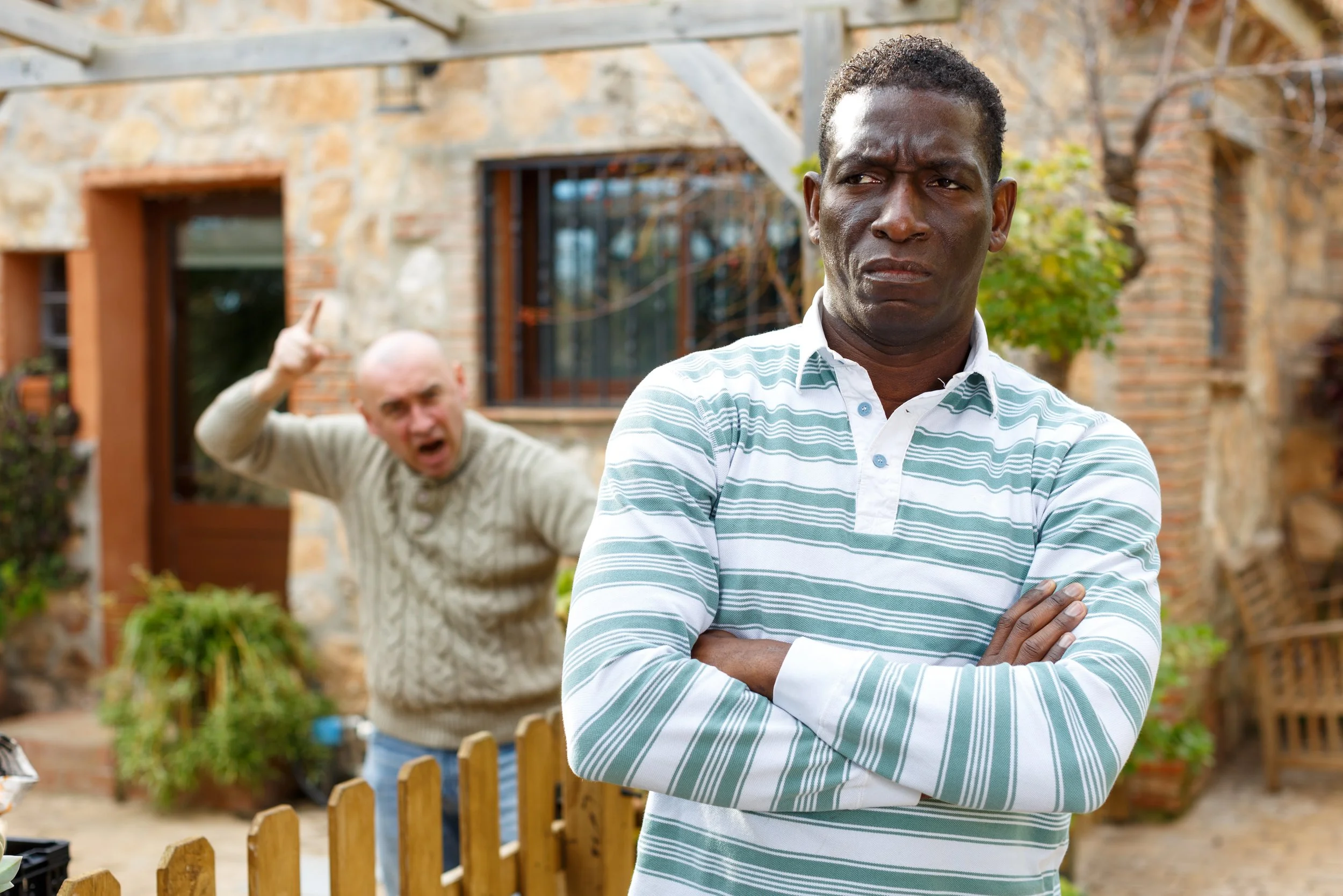 Neighbours in legal dispute, arguing over property boundary and trespass