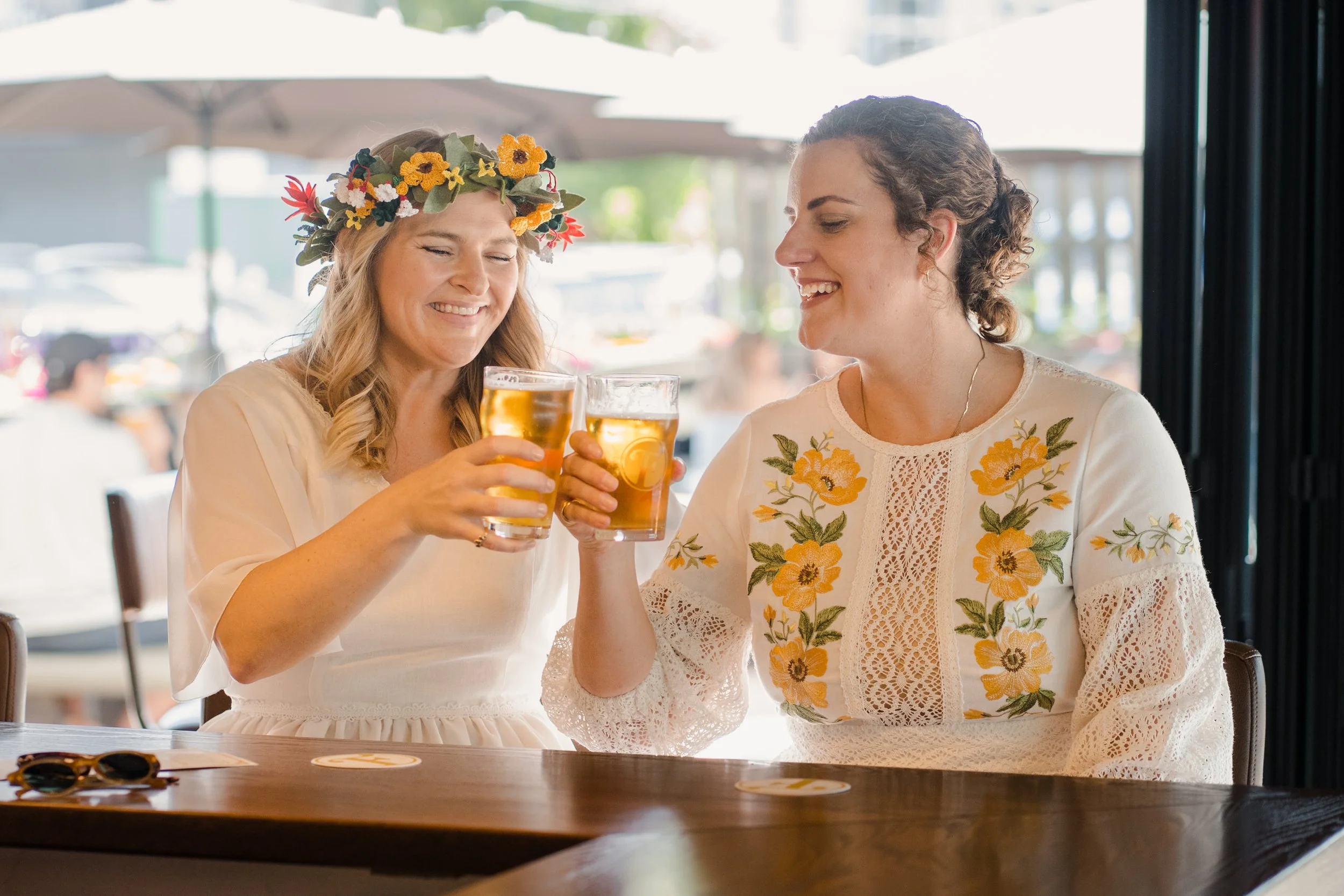 brides-toast-queer-wedding-couple-franks-pub.jpg