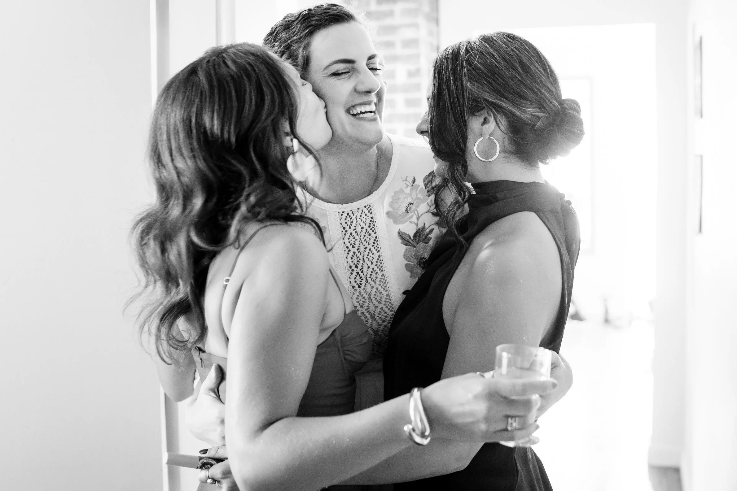 yeg-queer-wedding-hugging-bridesmaids.jpg