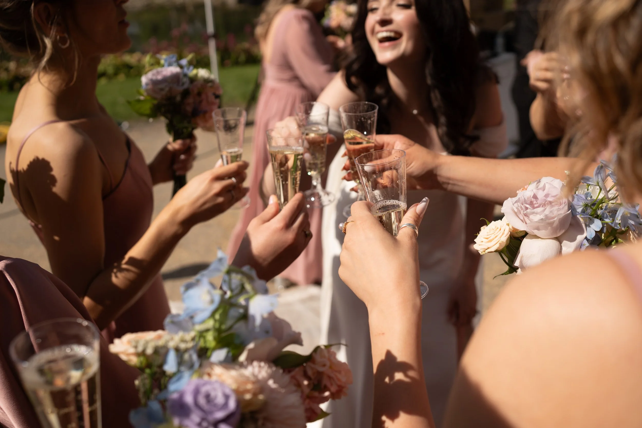 candid-toasting-flowers-wedding-photo-aga-khan-gardens.jpg