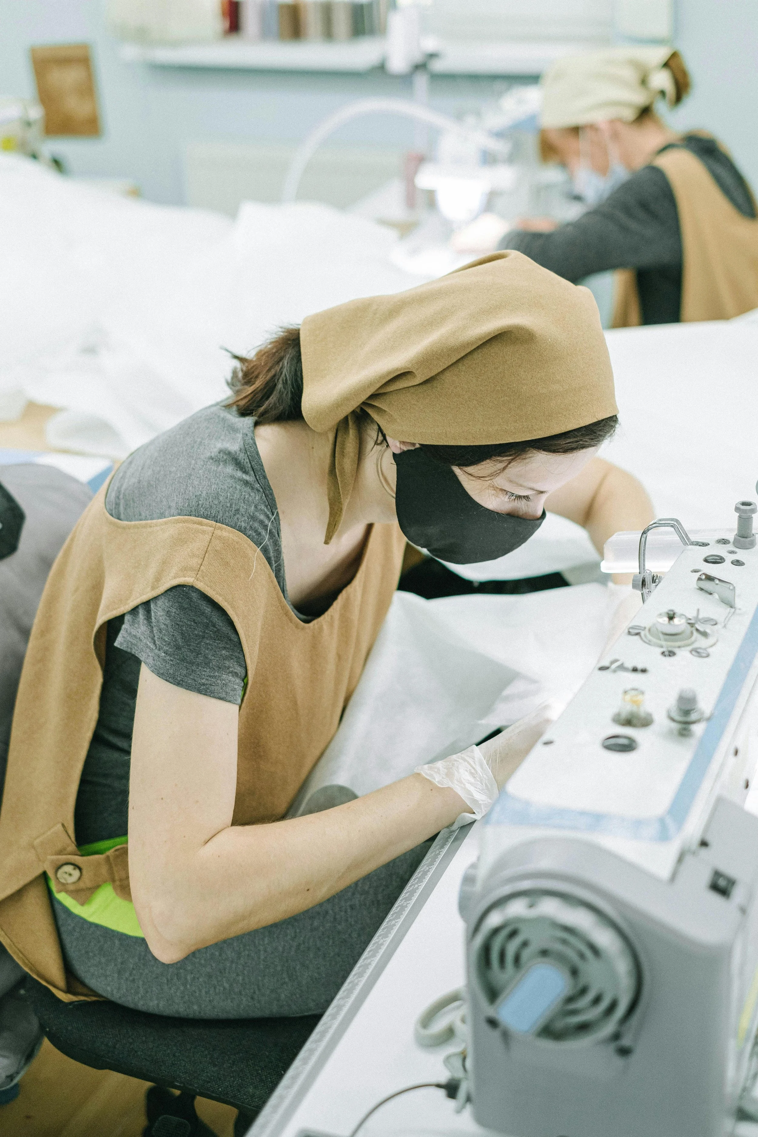a woman using a sewing machine