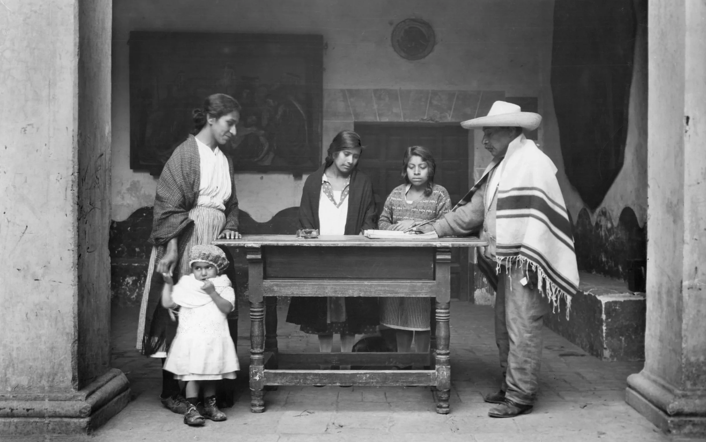 Mexican family signing a visitors book at a in Mexico 1929 © James Abbe Archive