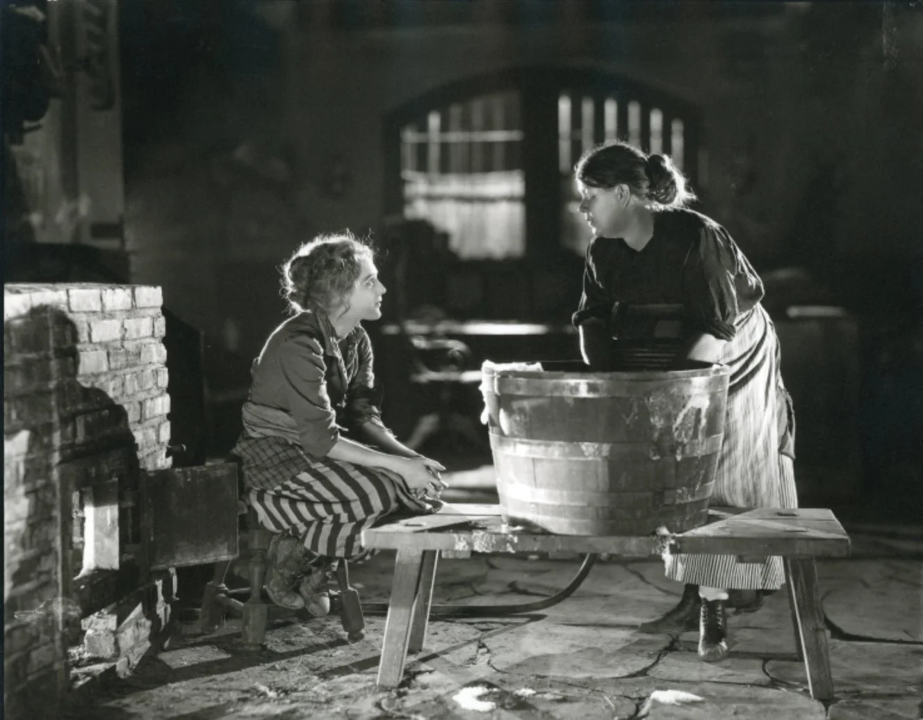 Mary Pickford, left, in the film "Suds," 1920 © James Abbe Archive