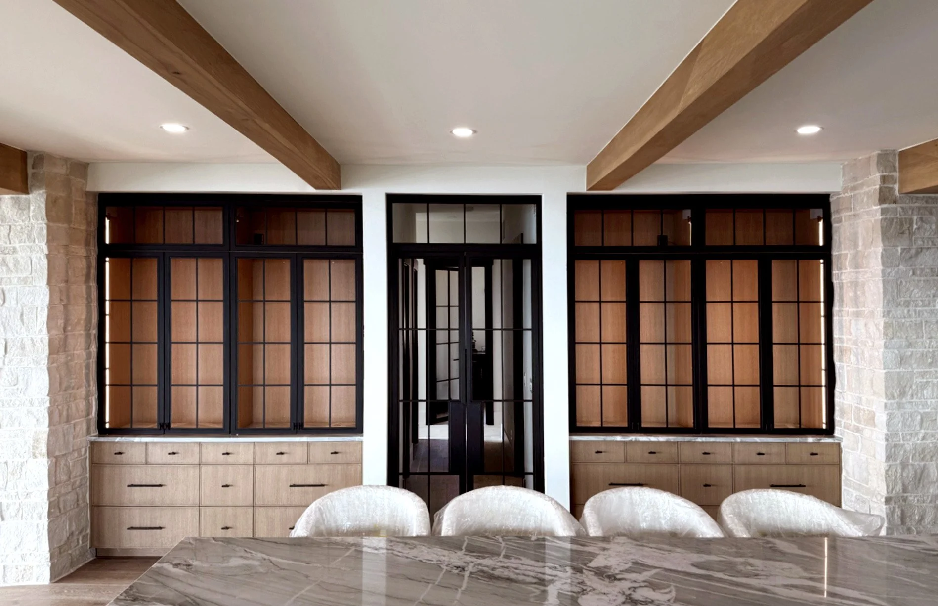 Custom steel cabinetry integrated into high-end kitchen