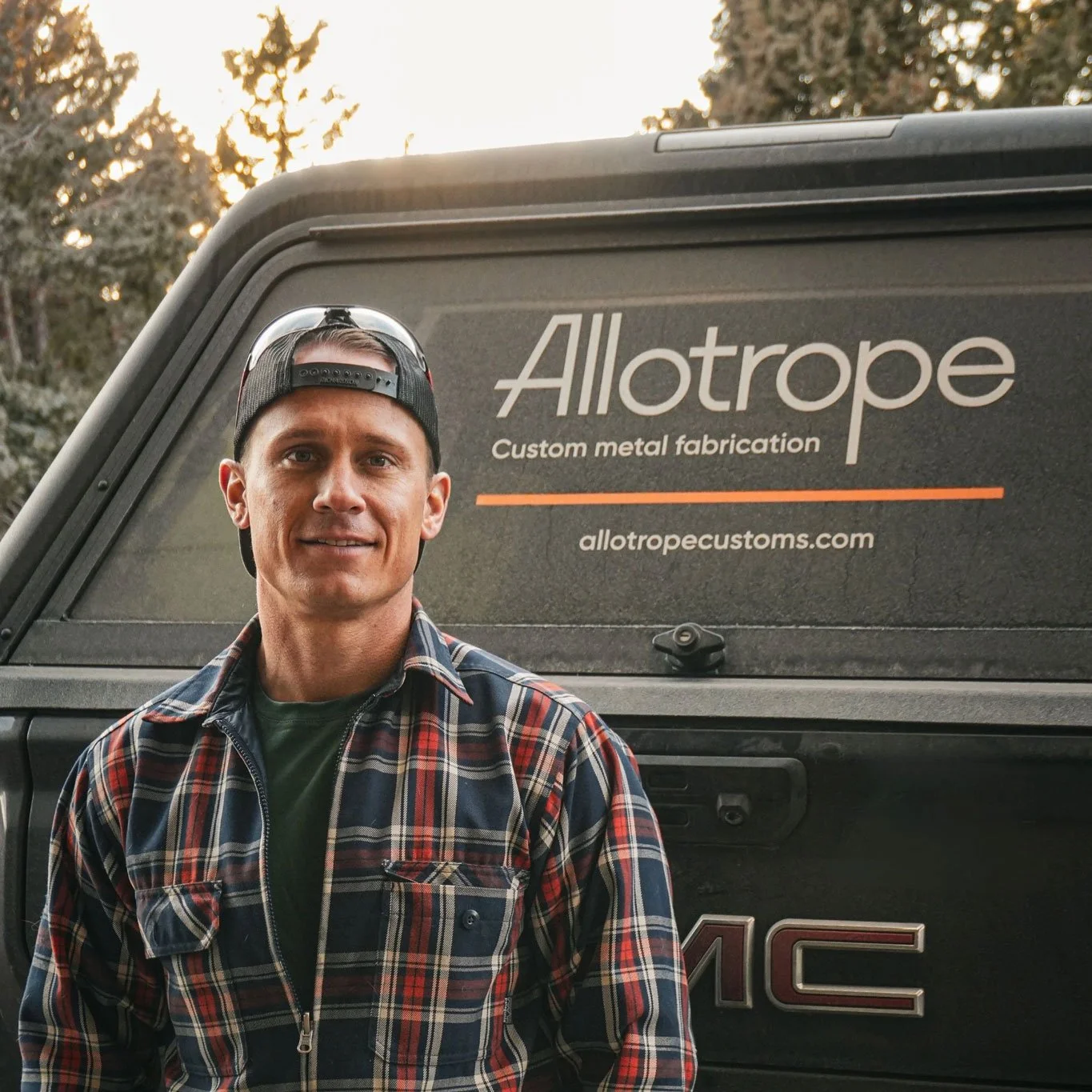 Colorado metal fabricator standing by branded work truck for residential fabrication projects