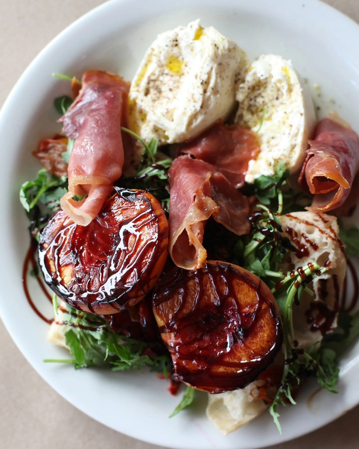 PREACHIN&rsquo; IT TO THE PEACH LOVERS. 🍑
LAST OF THE SEASON PEACHES #rockingchairfarm
BURRATA &amp; PROSCIUTTO #sognotoscano
ARUGULA, BASIL, BALSAMIC GLAZE &amp; TOAST. 
COME TASTE THIS ALONG WITH OTHER NEW &amp; EXCITING MENU ITEMS THIS WEEKEND! 
