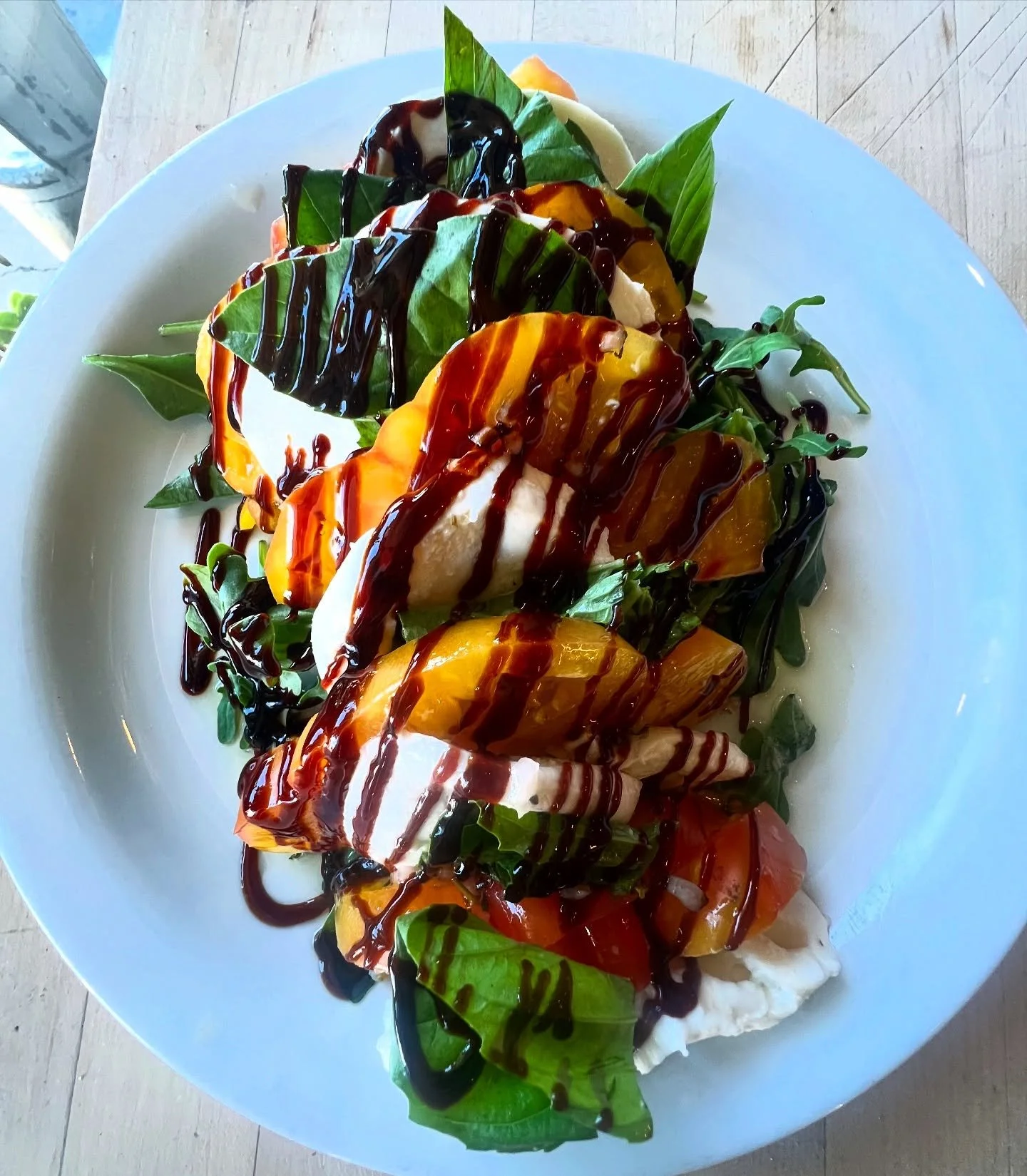 We don&rsquo;t often drizzle, but when we do&hellip; 
It&rsquo;s with sweet &amp; tangy balsamic reduction, atop layers of juicy local heirloom tomato &amp; fresh mozzarella cheese with an adornment of basil leaf. All the things of late summer harves