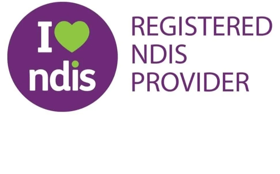 Logo with purple circle containing the text "I" with a green heart as the "o" in "I" and "ndis" written below. To the right, the text states "REGISTERED NDIS PROVIDER" in purple.